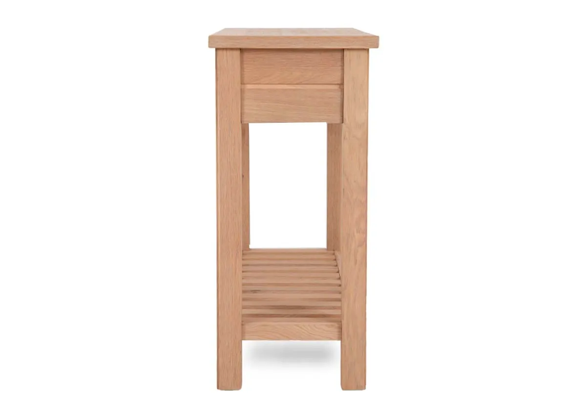 A 2 drawer oak console table with lower shelf from EZ Livings Albany range. Side view