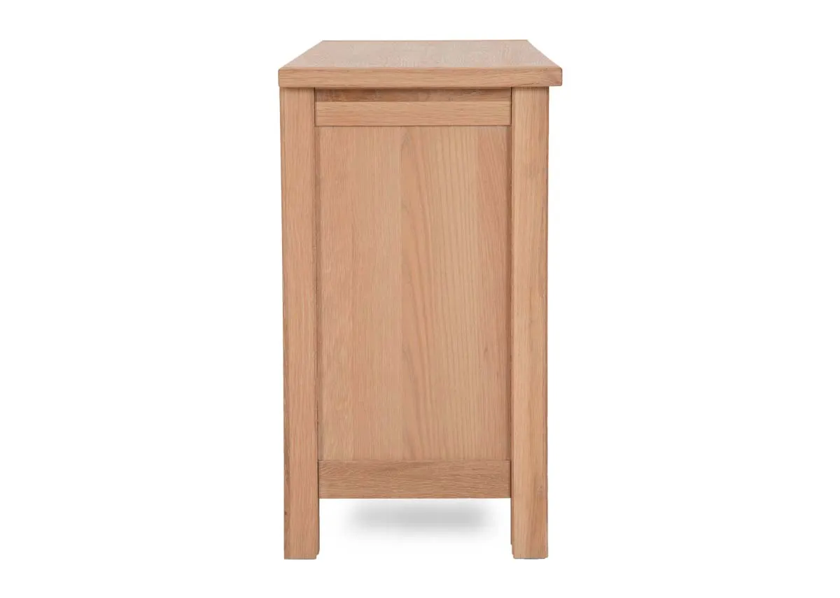 A 2 drawer oak console table with lower shelf from EZ Livings Albany range. Side view