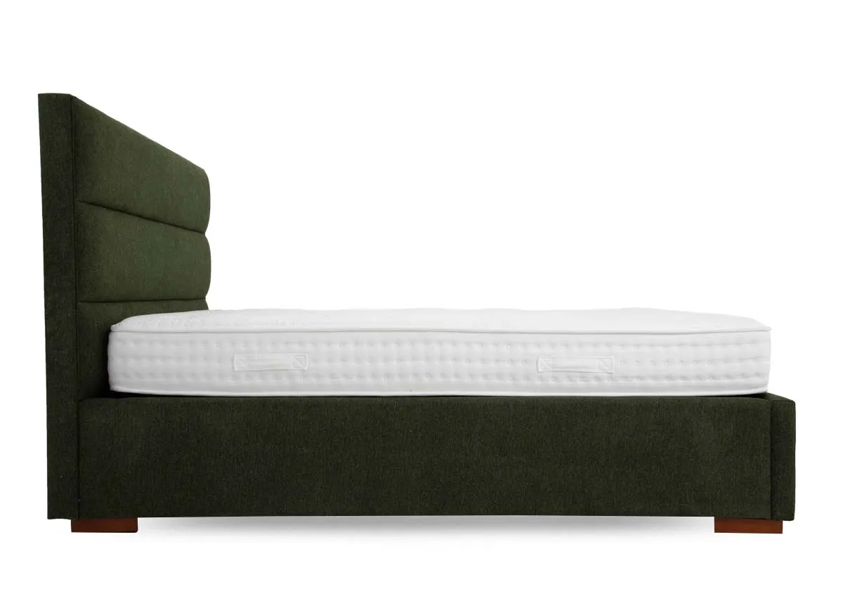 A green fabric ottoman from EZ Livings Ebony range. Side view of fabric covered sides