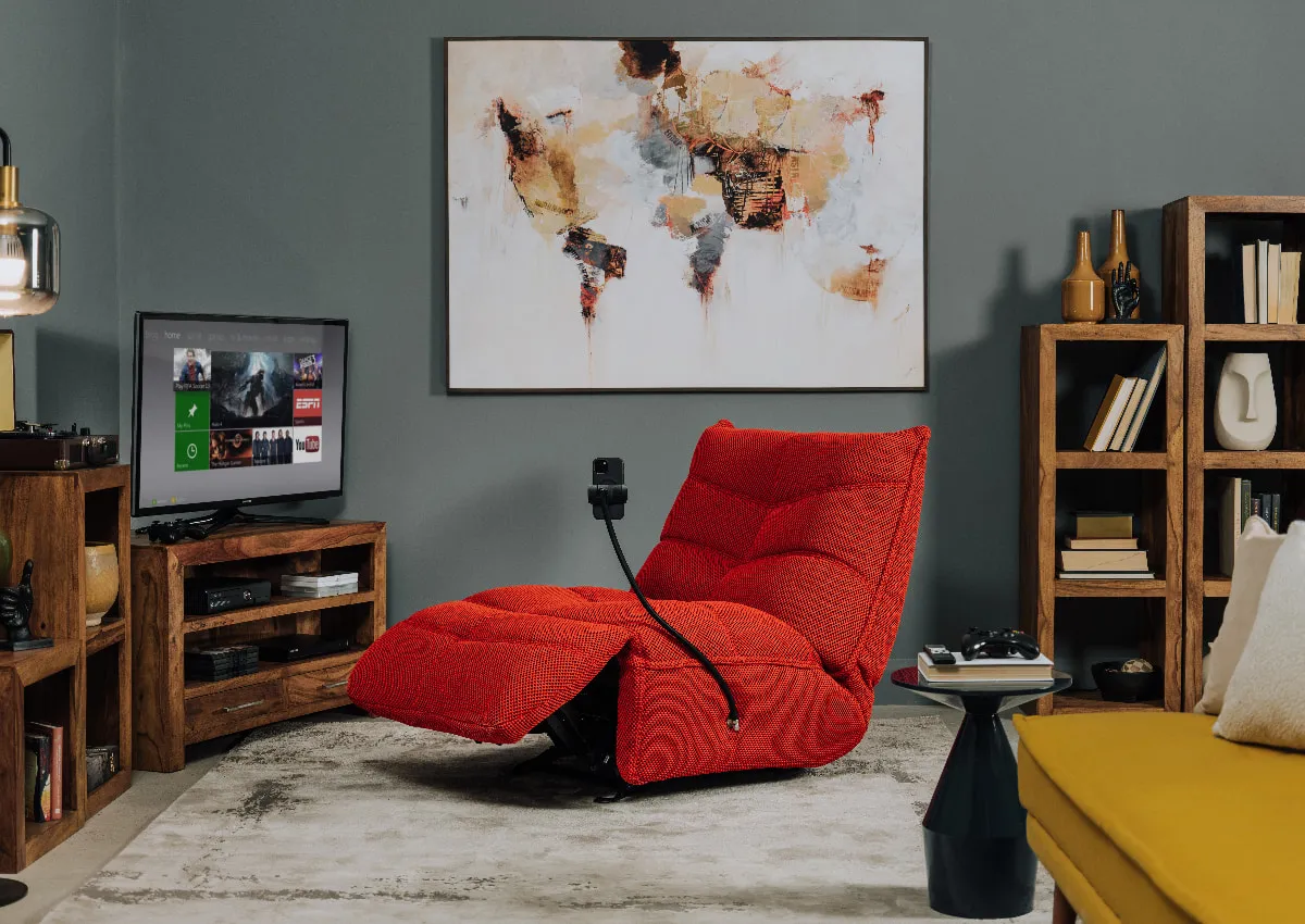 A lifestyle image of the Wordlwide print with Sonic red gaming chair and Polygon shelves