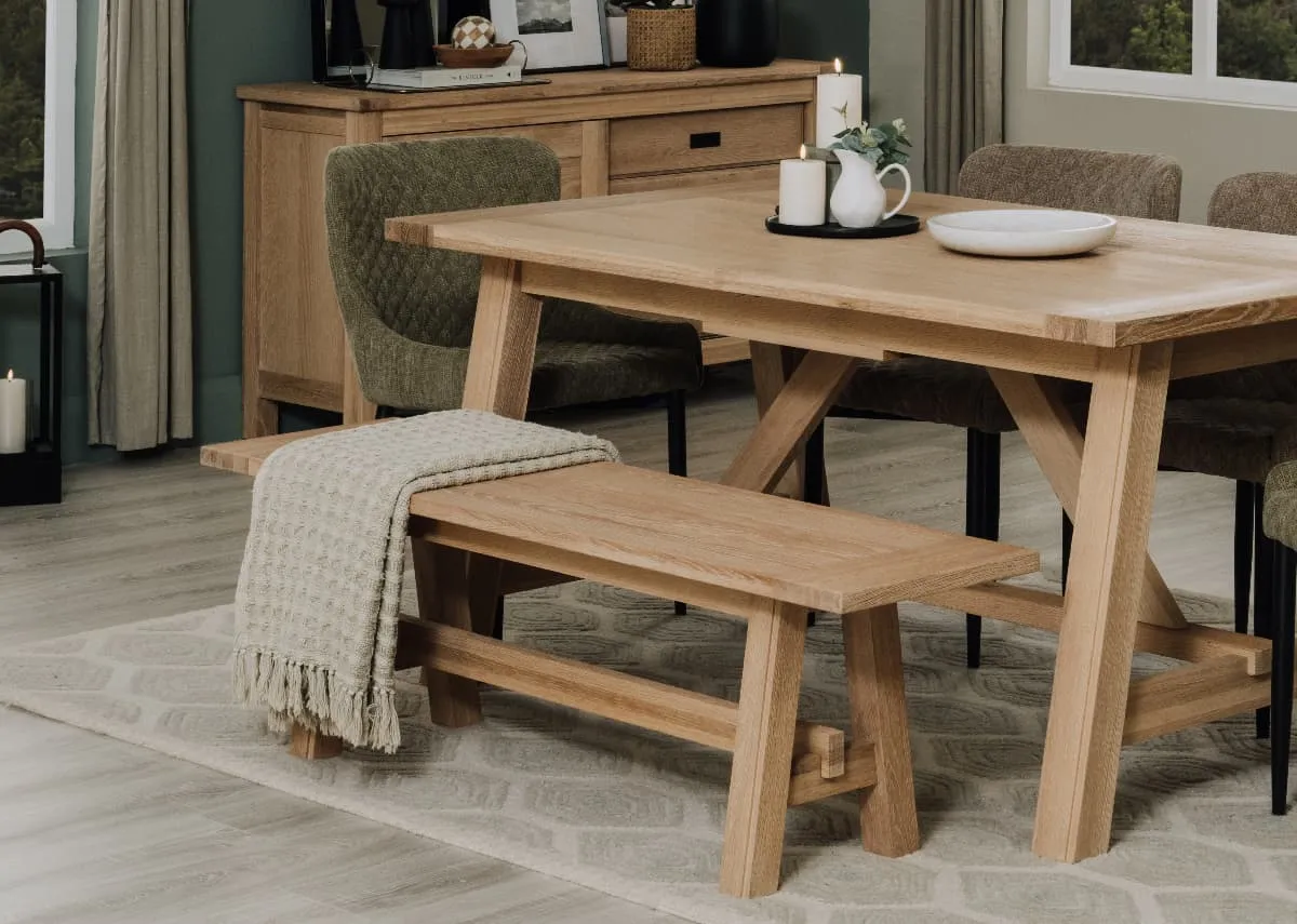 A lifestyle image of the Albany dining tabl and bench with waffle throw.