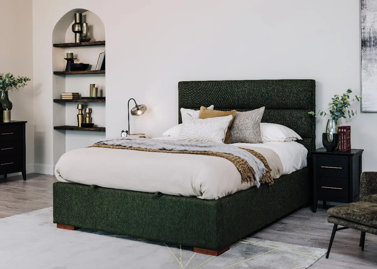A lifestyle image of the Ebony green bed with mattress with chevron side locker