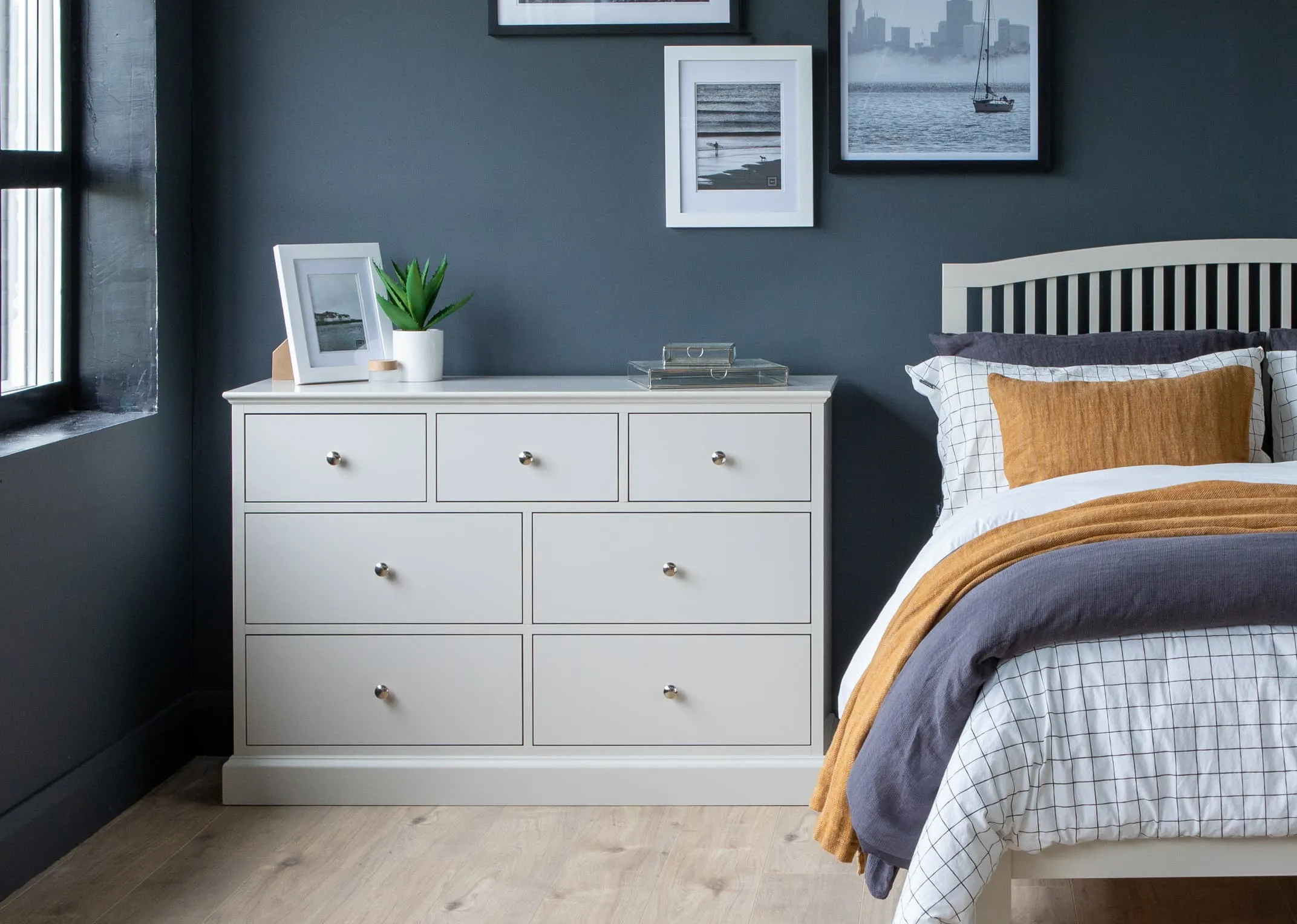 A lifestyle image of the grey 5ft rivendale bed with large Chest & locker from EZ Living Furniture