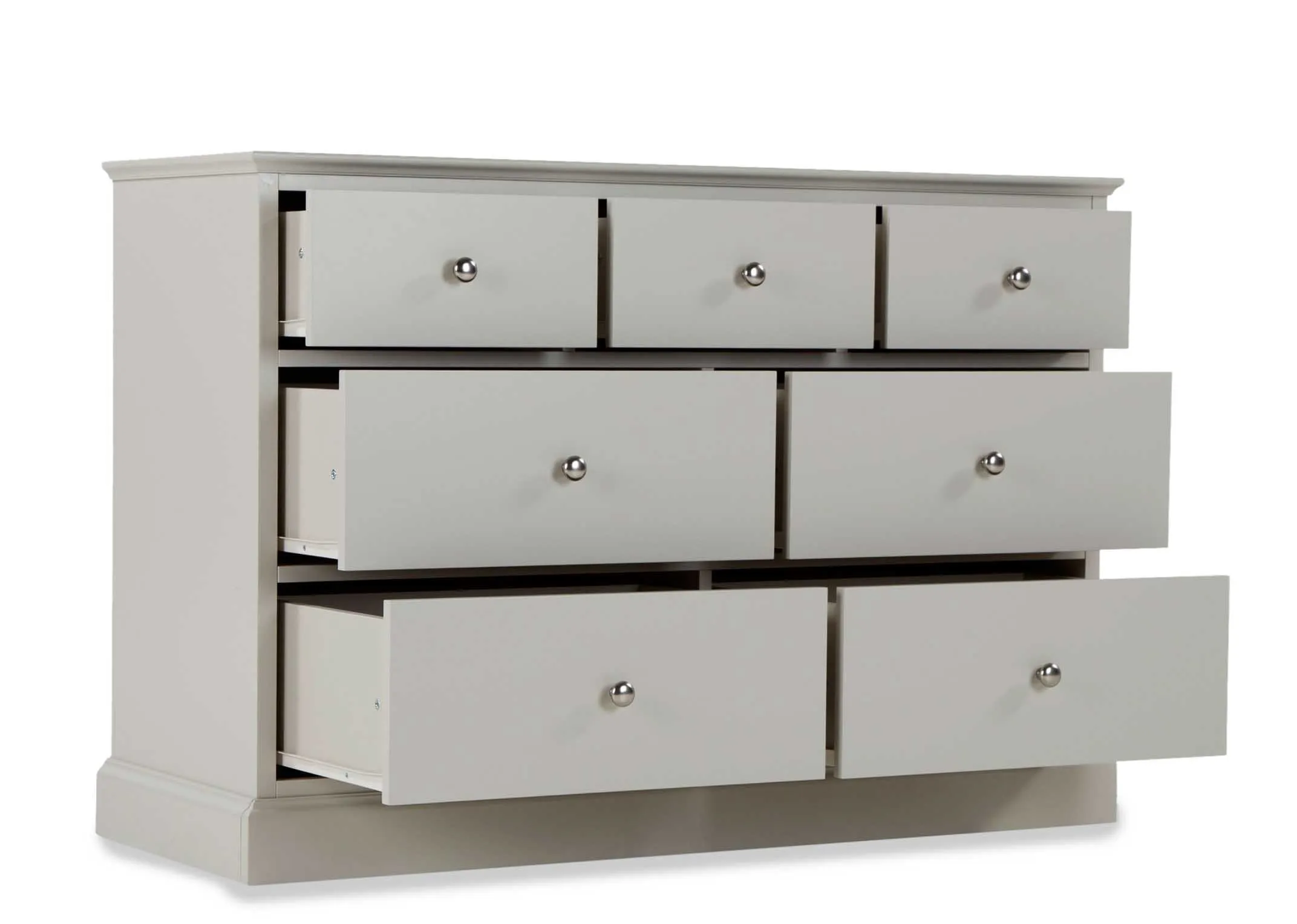 Angled shot of the Rivendale three over four grey chest of drawers with all drawers in an open position