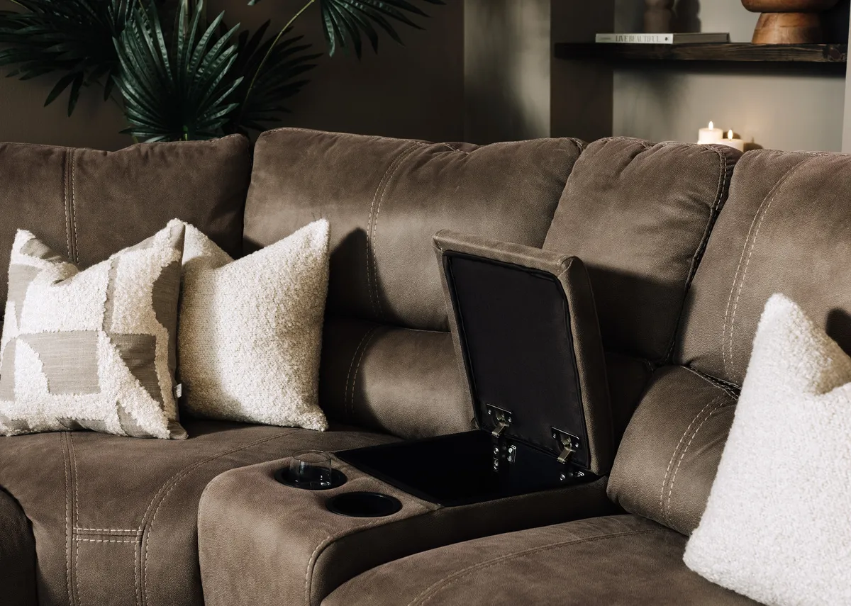 A lifestyle image with a closeup on the drinks holder with room for 2 holders.