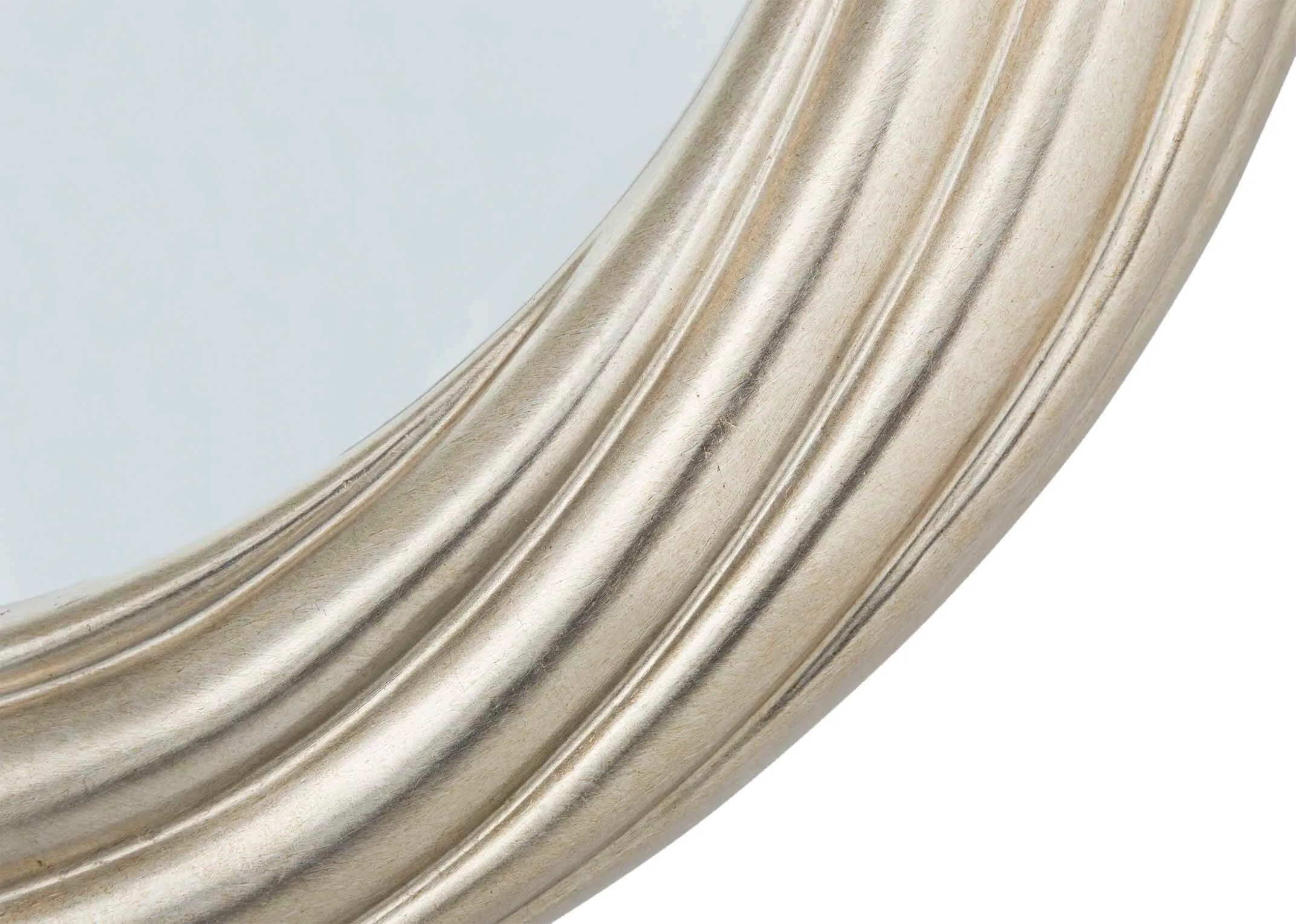 A close up showing the detail on the edge of the Gemma gold round wall mirror.