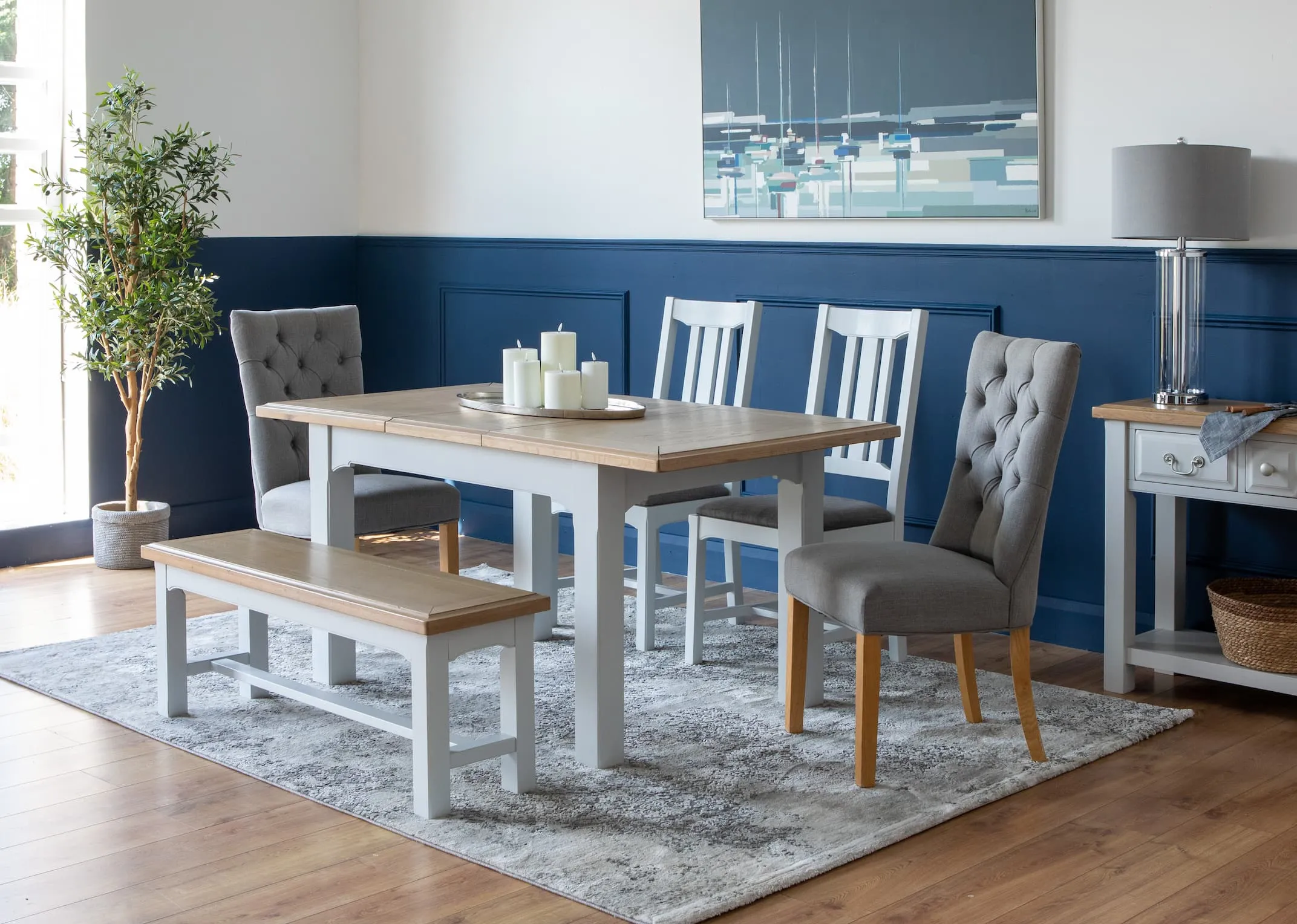 A lifestyle image of the Georgia Rectangular small table extended with console & Visby lamp.