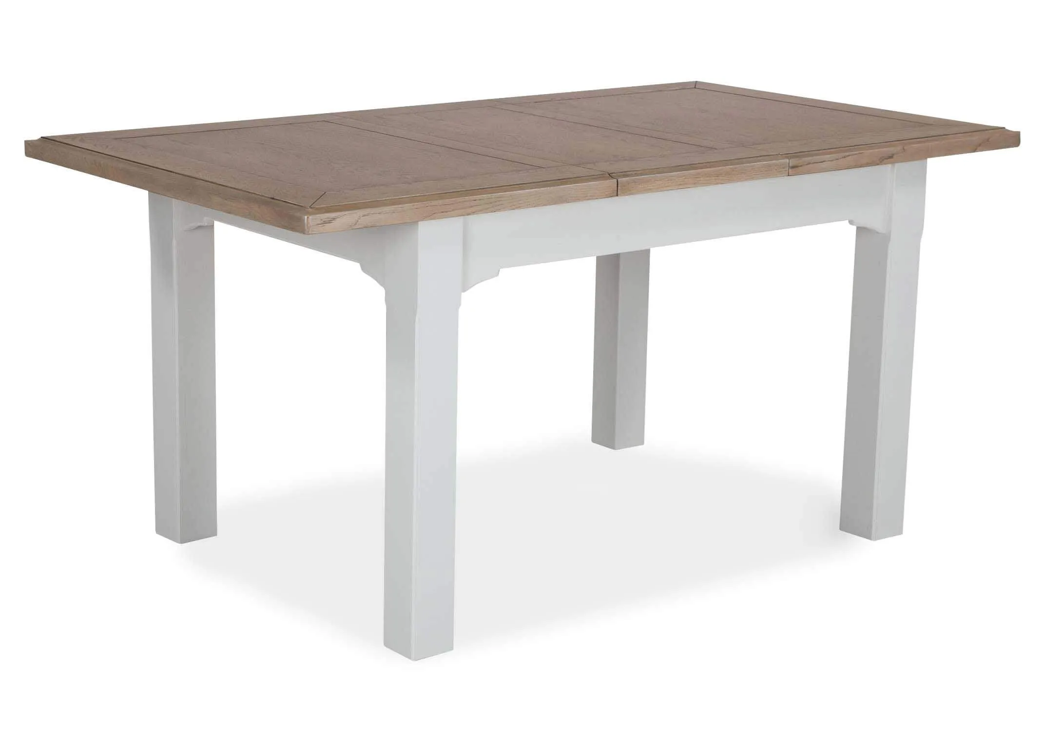 Angled view of the front of the dual coloured solid oak Georgia dining table with leaves extended