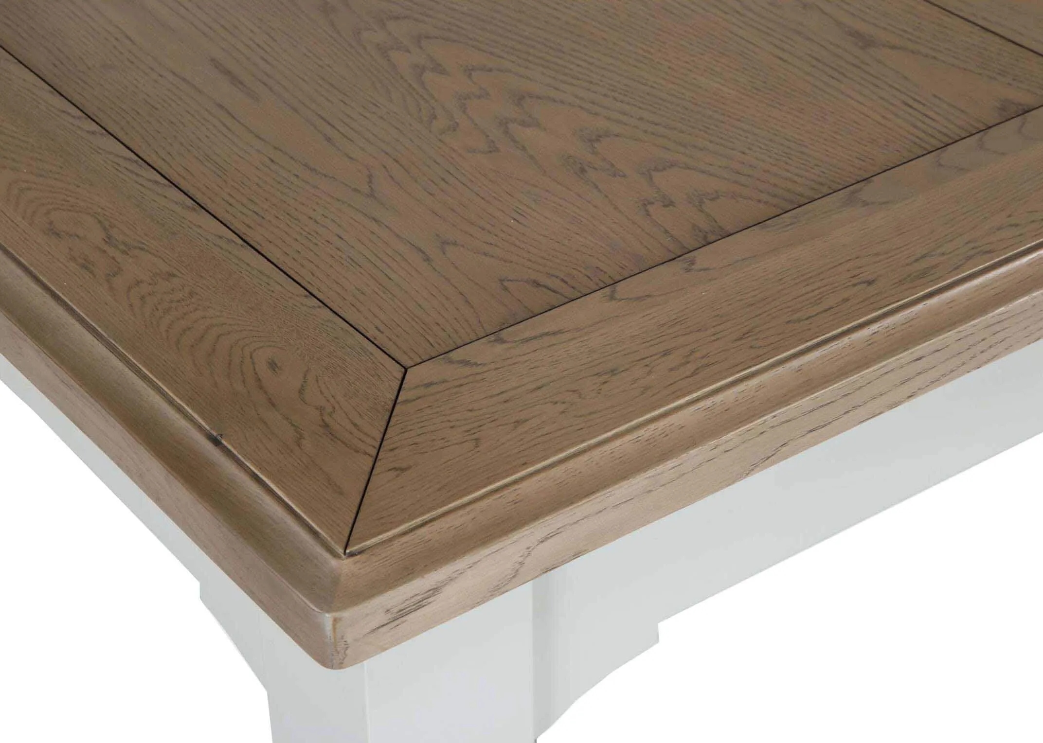 Close-up view of natural oak table top of the front of the dual coloured solid oak Georgia dining table