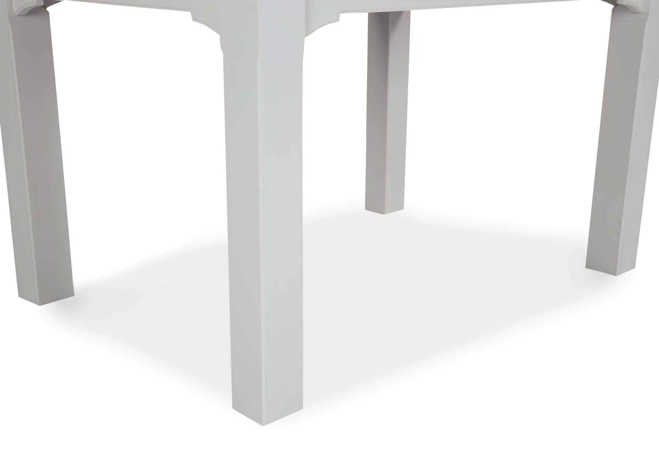 Close-up view of legs of the front of the dual coloured solid oak Georgia dining table