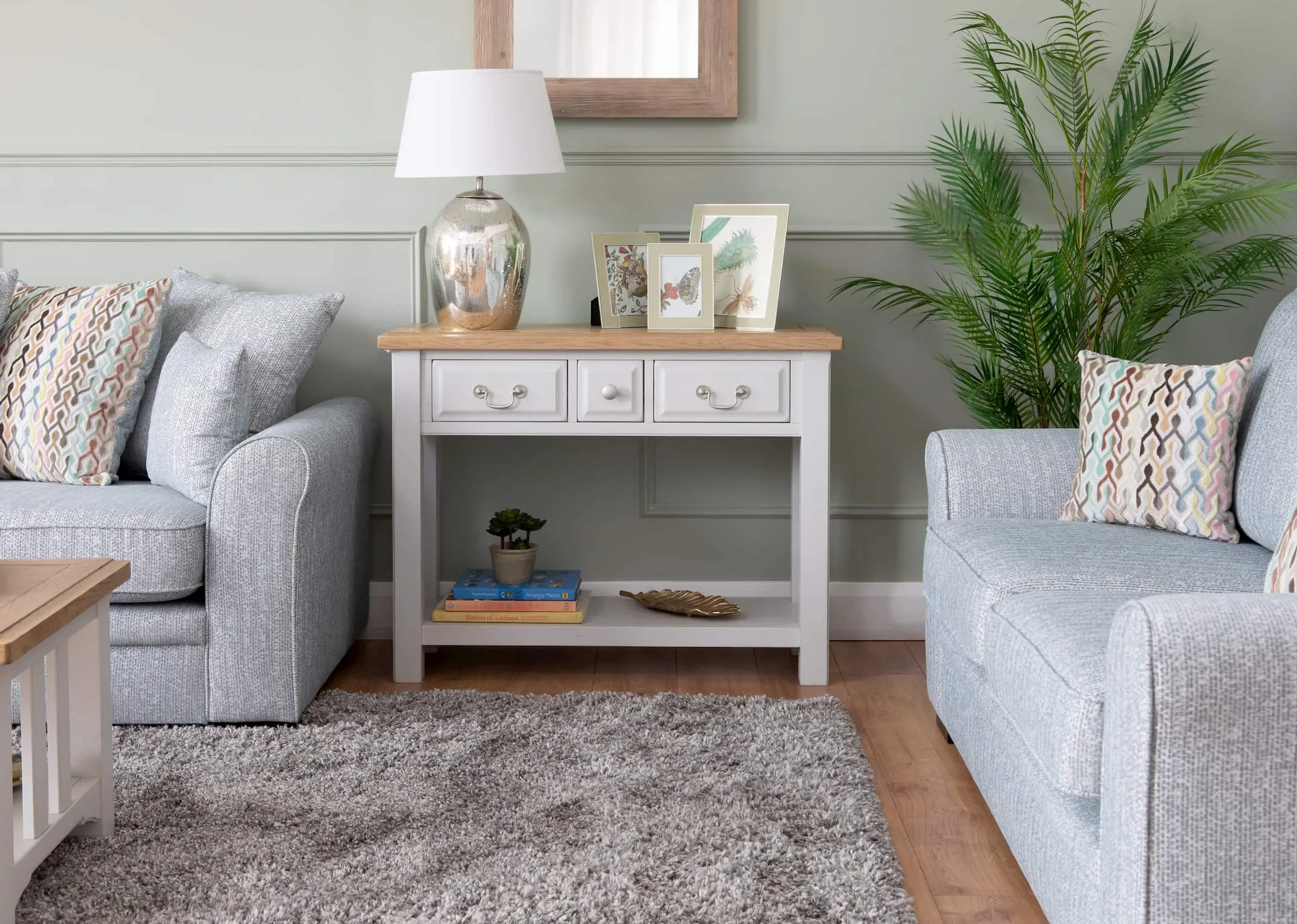 A lifestyle image of the Georgia Console table with Valencia Sofa & wooden mirror