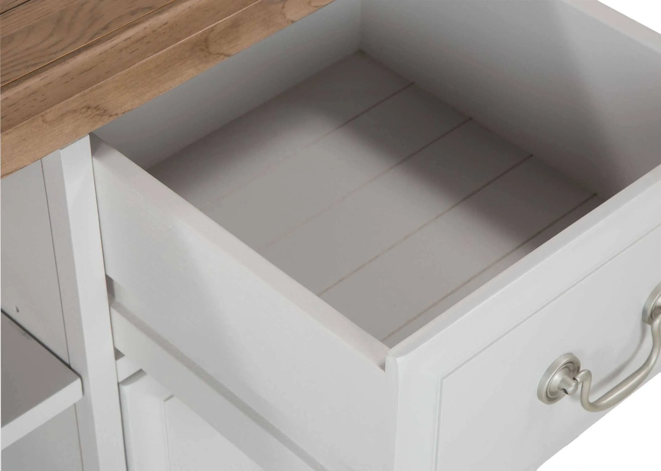 A close up image looking down into an open drawer of the Georgia 4 drawer 2 shelf tv unit.