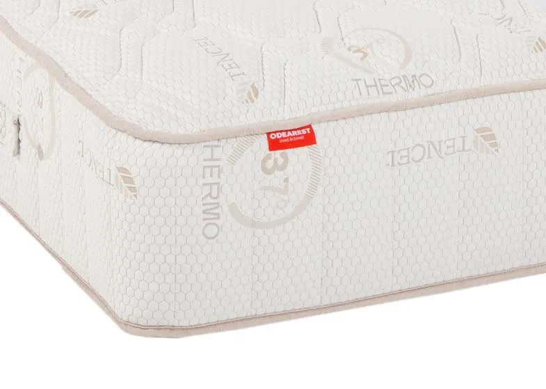 A 4ft 6 pocket spring white mattress from EZ Living's Odearest range.Closeup of taupe trim