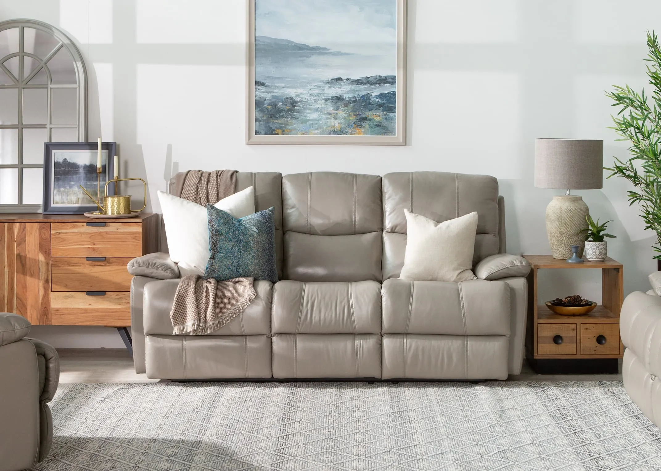 A 3 Seater reclining sofa in soft grey leather from EZ Living Furnitures Groove range. Closeup bottom.