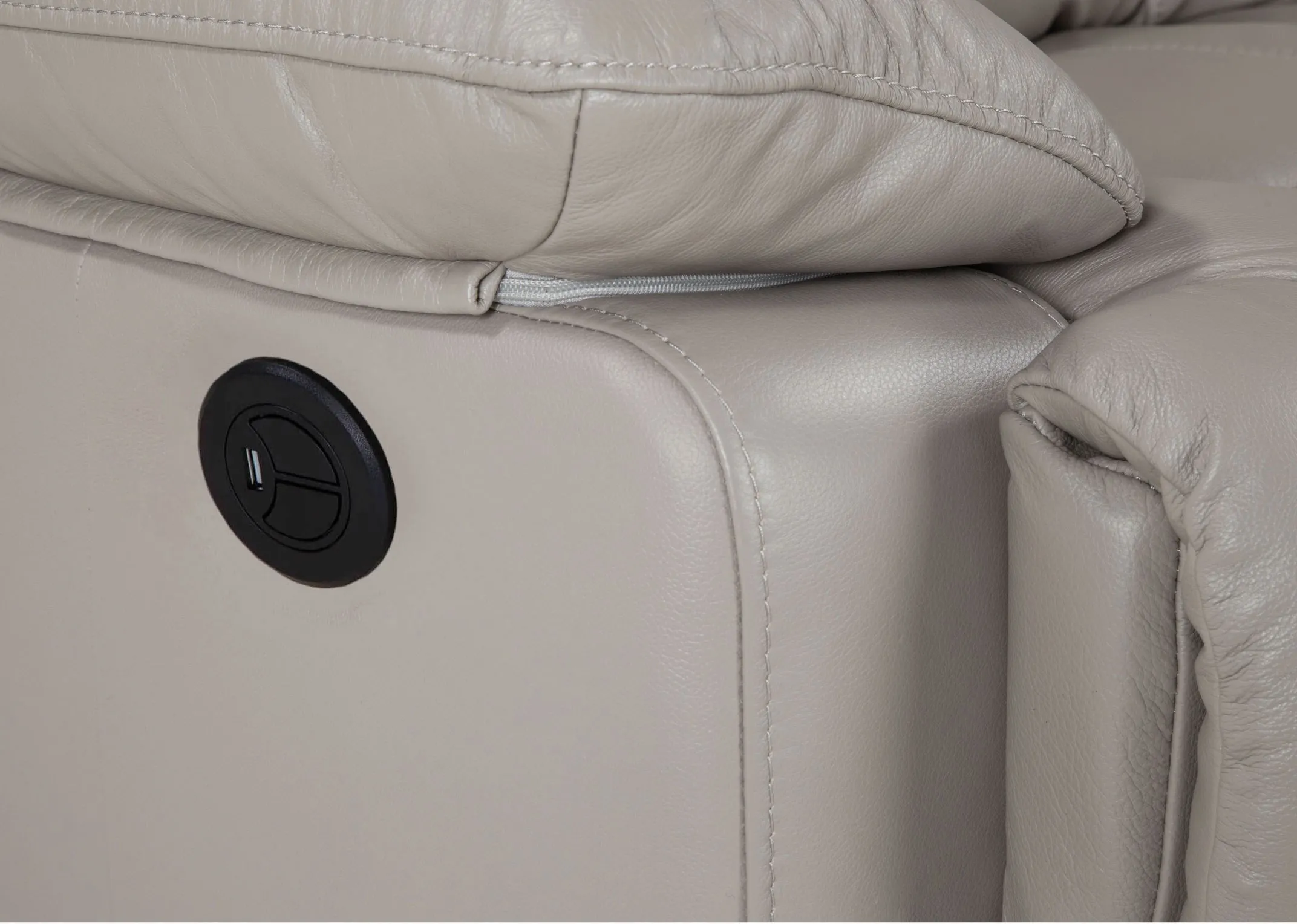 A 3 Seater reclining sofa in soft grey leather from EZ Living Furniture's Groove range. Closeup button.
