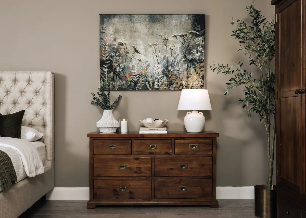 A lifestyle image of the Aisling dresser with fanciful canavs with Nenagh lamp.