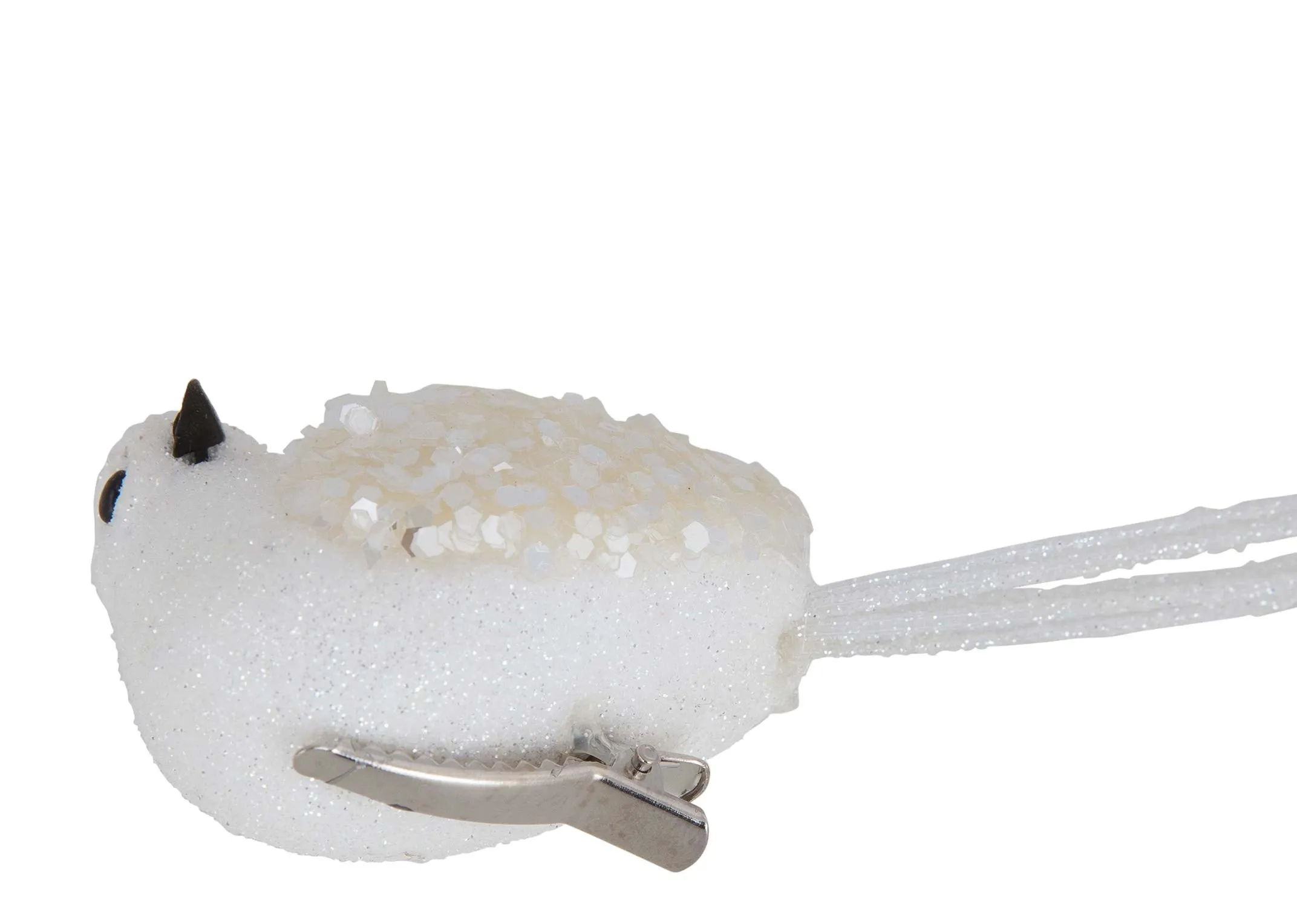A close up of the clip underneath the white bird with glitter wings christmas decoration.