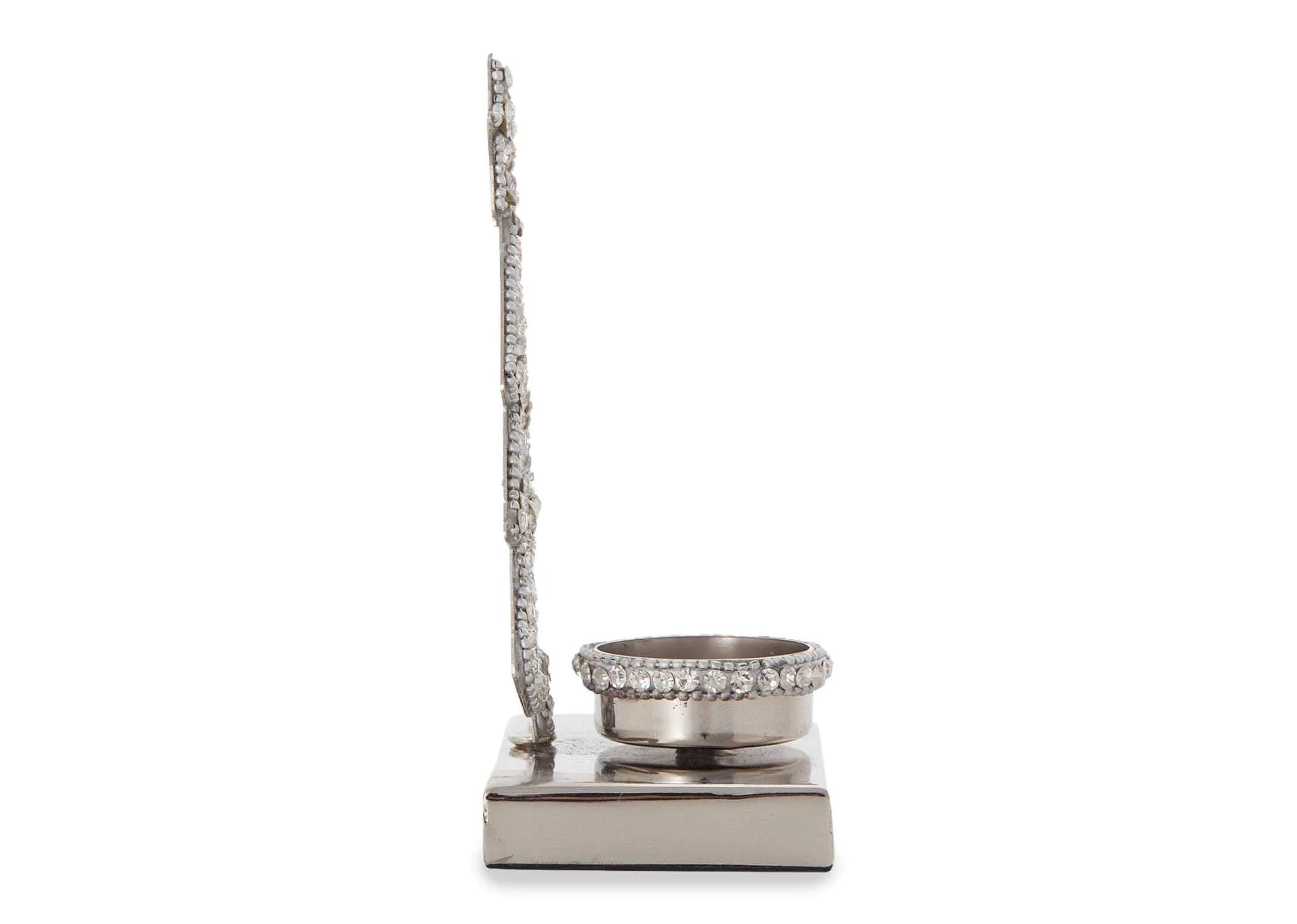 A side view of the silver christmas tree with light holder highlighting the depth of the piece.