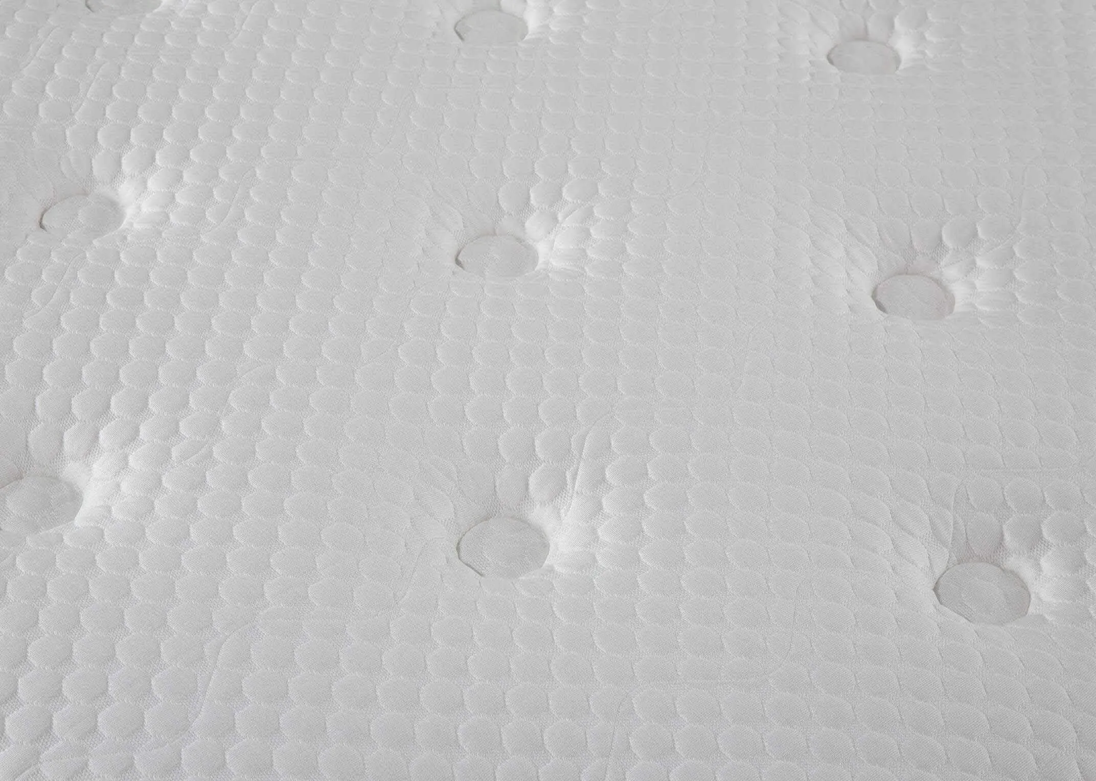 Detailed close-up of the button detail of the Rian white super king mattress