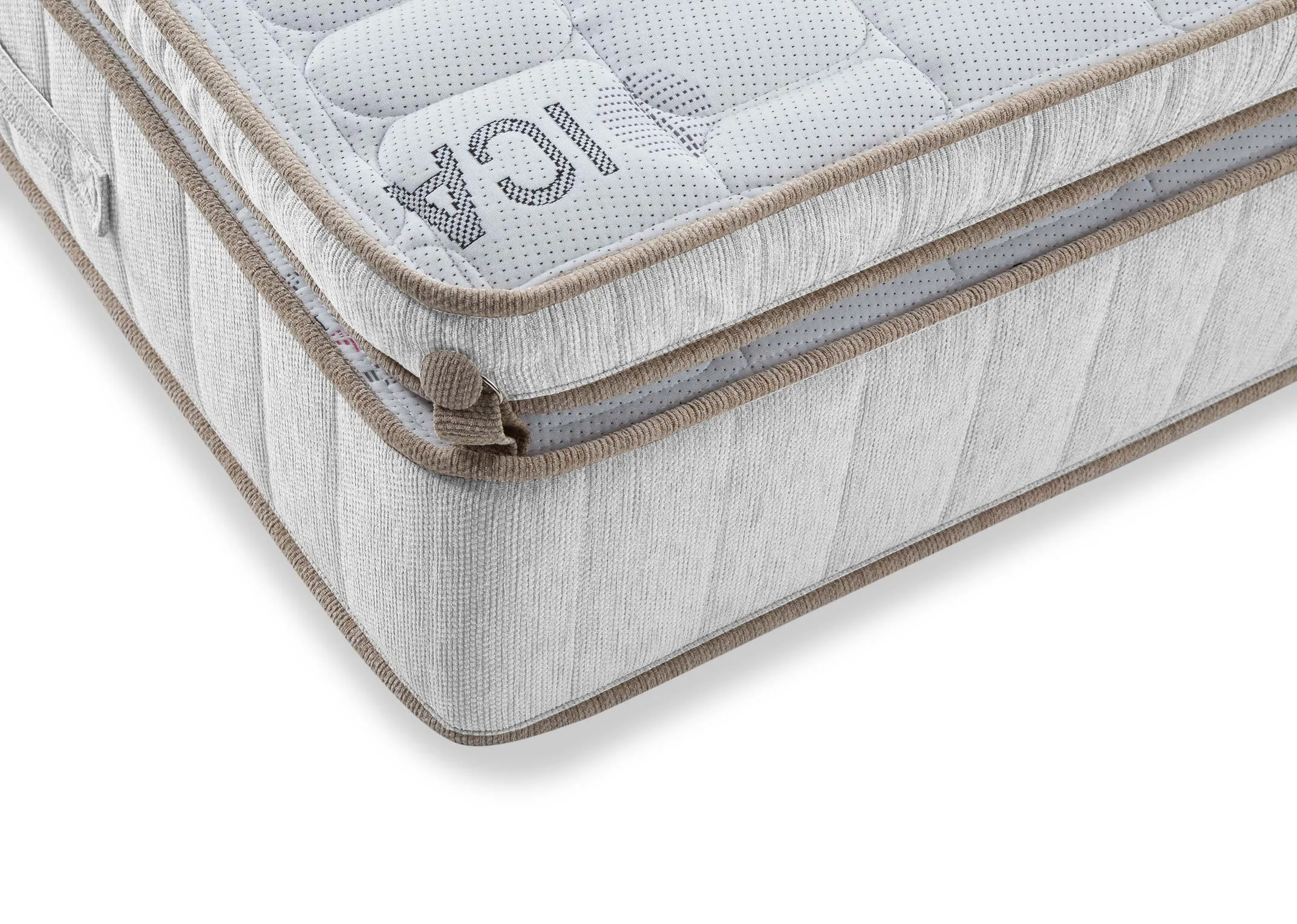 A close up of the surface on the Saol Fada  Platinum 1800 Super King 6 ft beige mattress. 