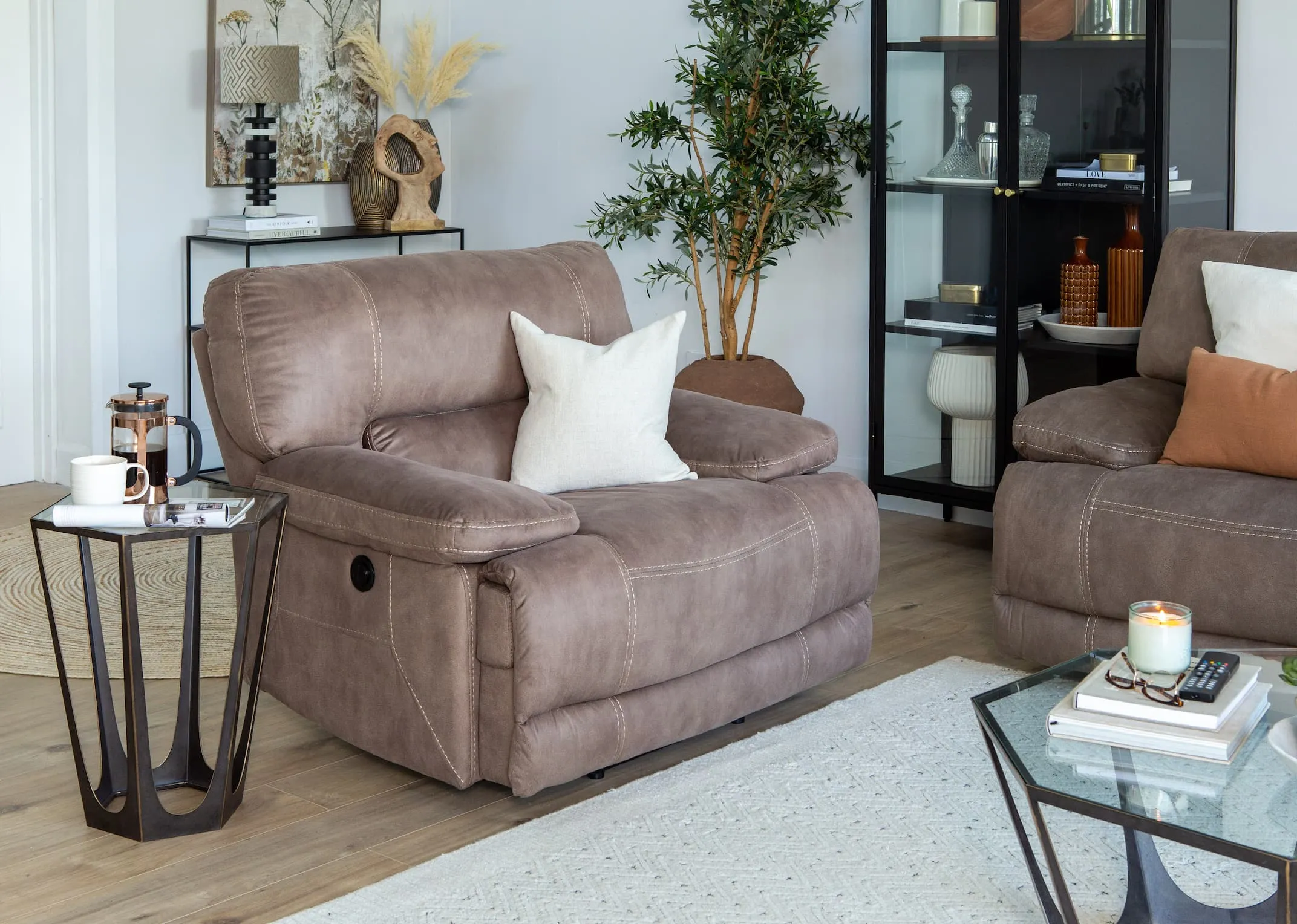 A lifestyle imange of the Baxter power recliner fixed mode with catalan tables and carmel cabinet.