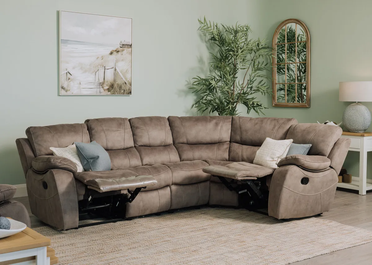 Detailed close-up view of the Hannah large grey faux suede reclining corner group showing the reclining handle