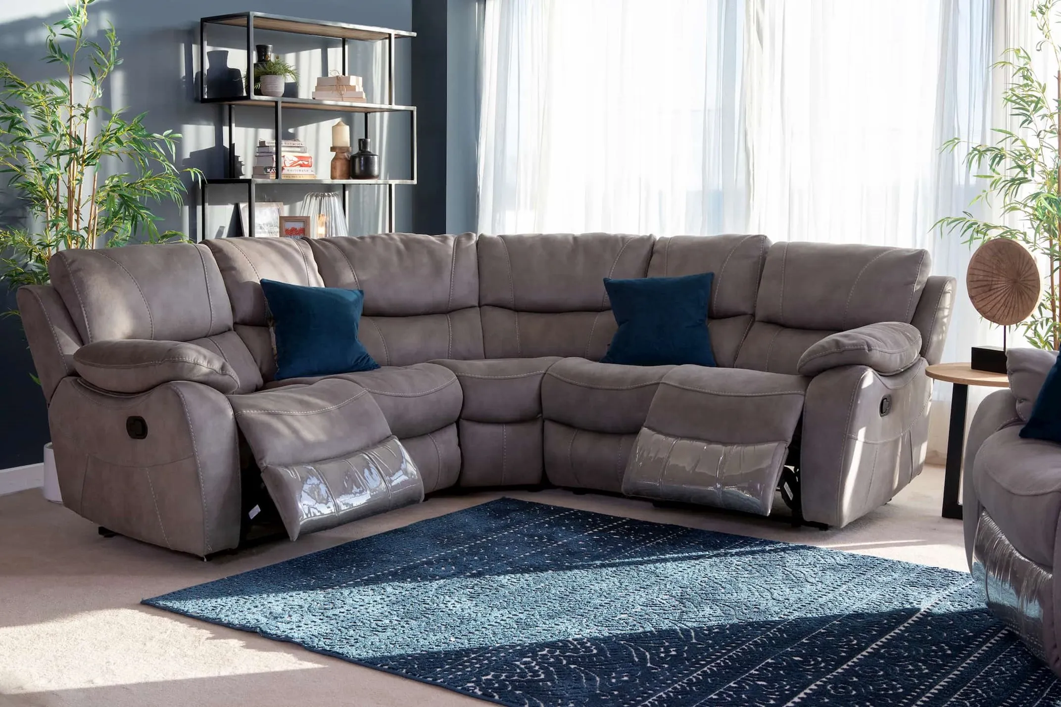 Large Grey Corner Sofa reclined from EZ Living Furniture's Hannah range in a lifestyle image with the Malta furniture.