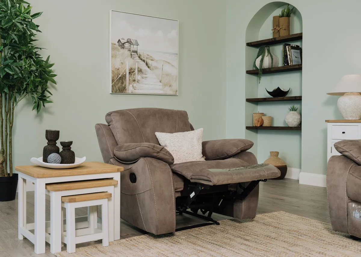 Detailed close-up of the armrest and seat of the Hannah grey faux suede fabric reclining armchair