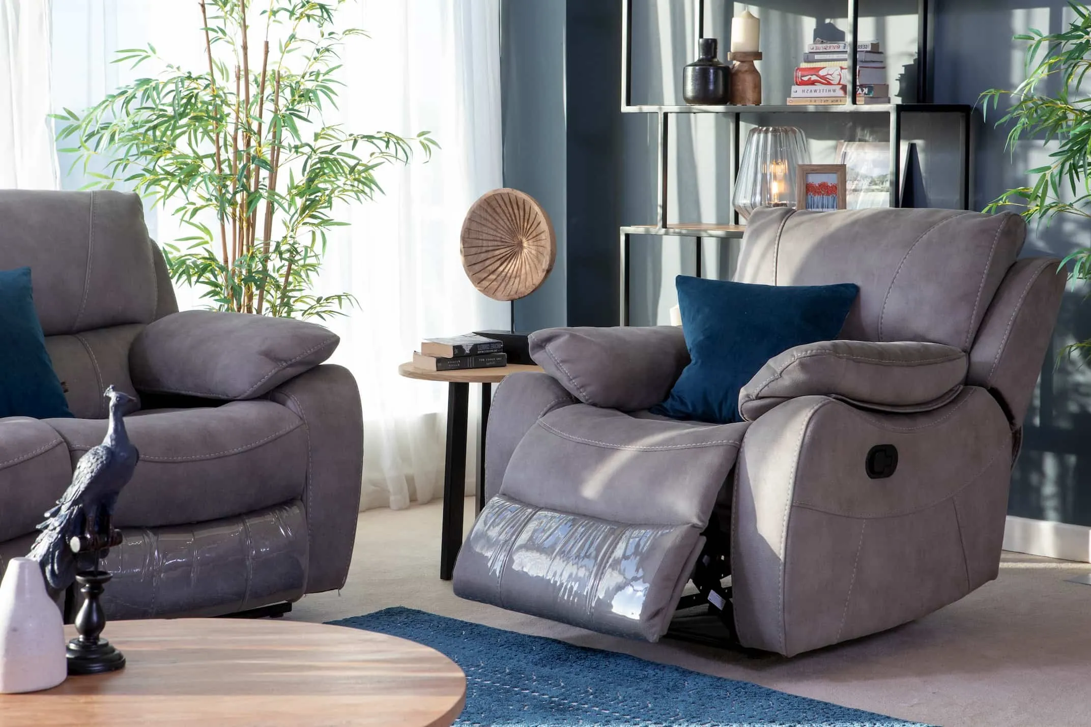 Hannah Grey Faux suede recliner in a reclined lifestyle image with the Corner Sofa & Malta furniture