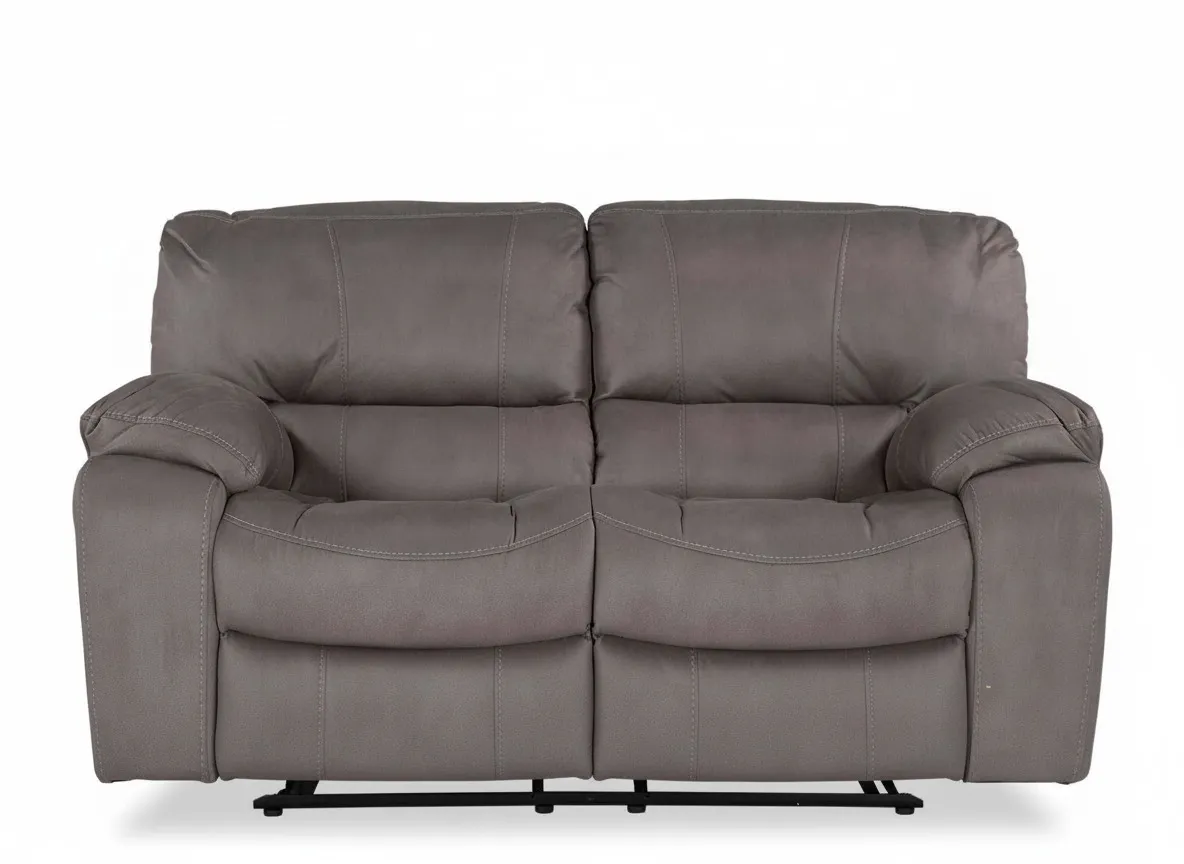 Detailed close-up view of the black reclining button from the Bradford 2 seater grey suede power reclining sofa