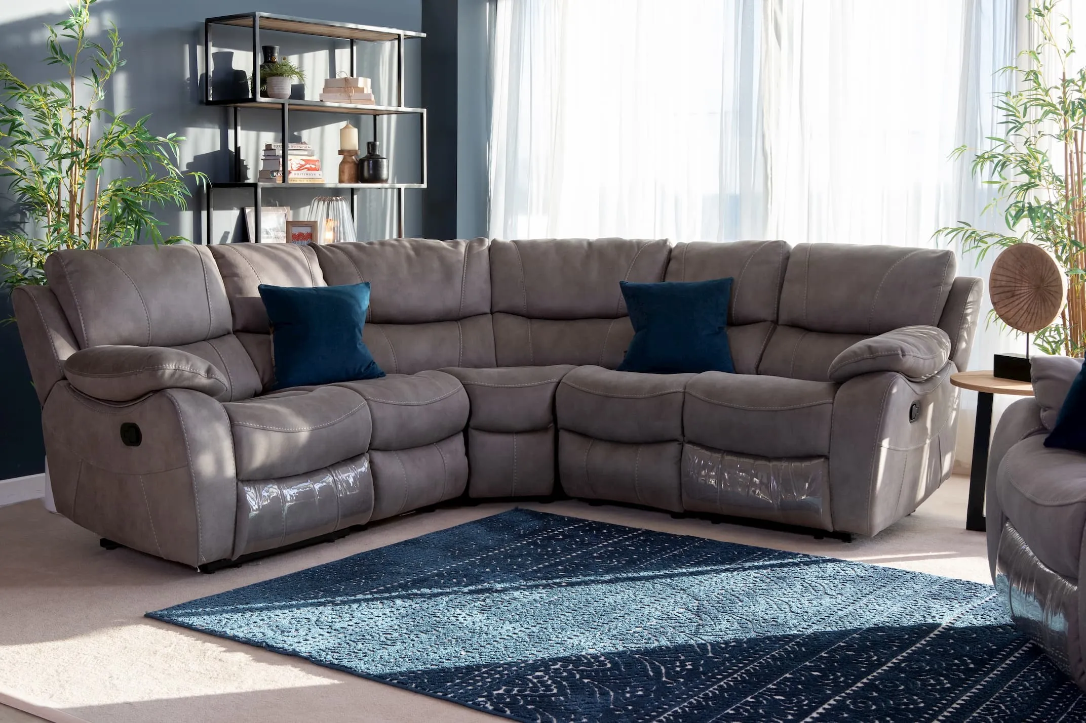A living room including the grey fabric armless unit from EZ Living Furniture's Hannah range. Lifestyle.