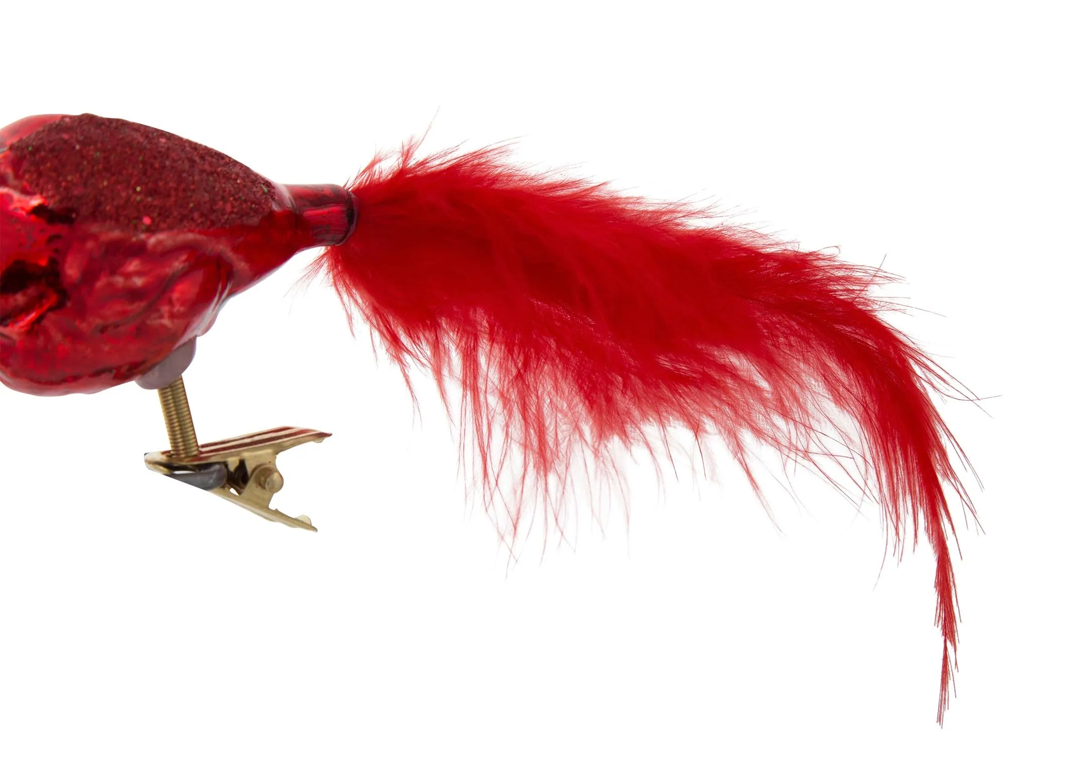 A clsose up of the tail on the red bird on clip Christmas decoration.