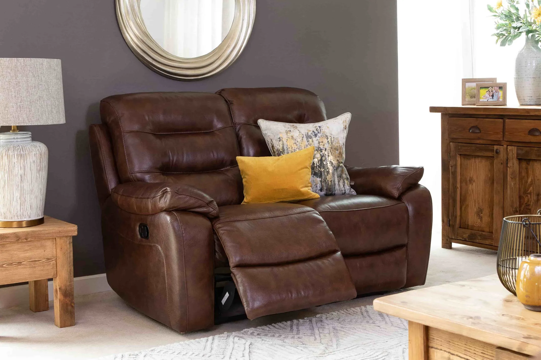 A lifestyle image of the brown leather Supreme 2 seater sofa available to order from EZ Living Furniture.