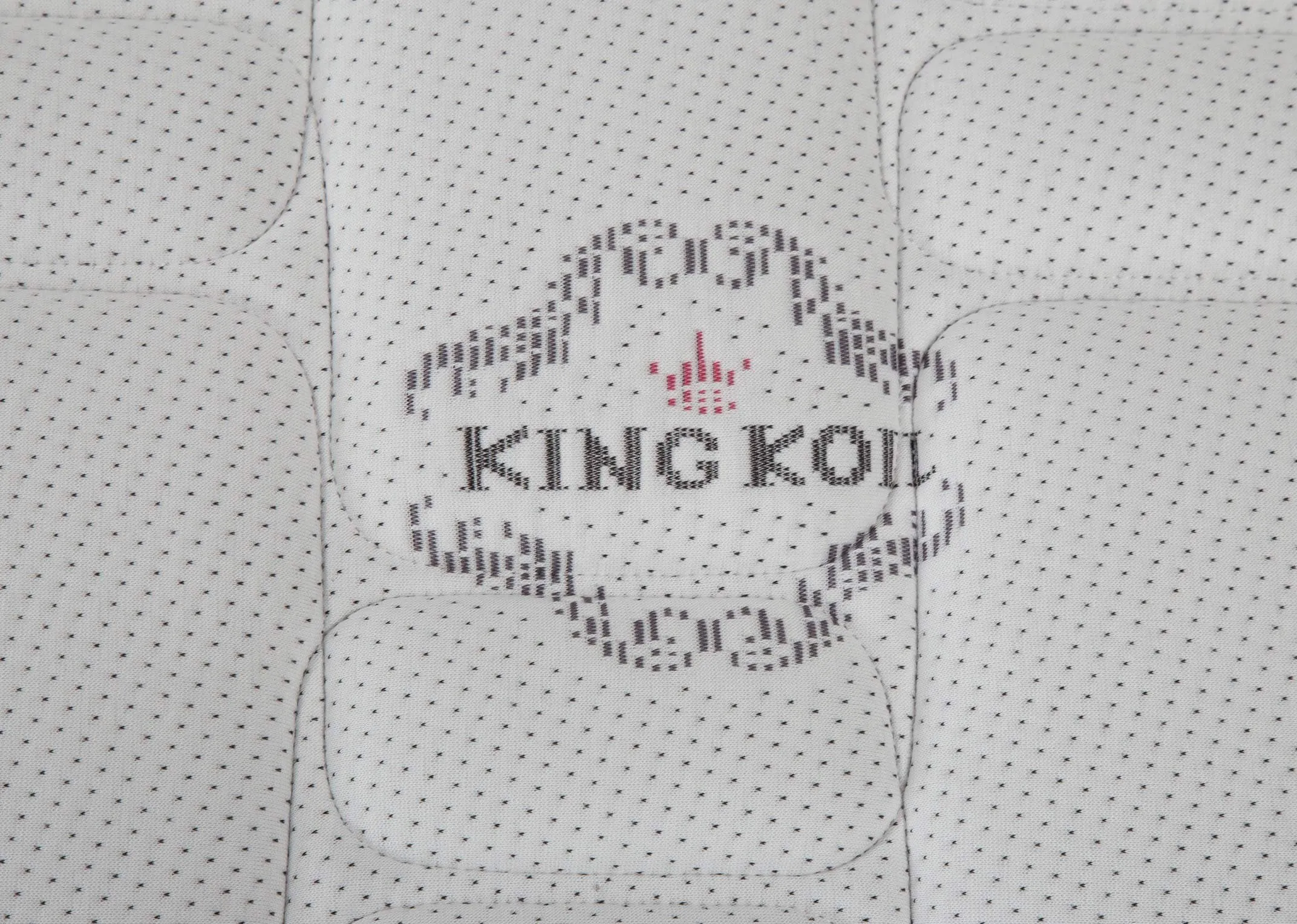 Detailed close-up view of the Posture Superbe king size 5ft mattress showing the King Koil logo