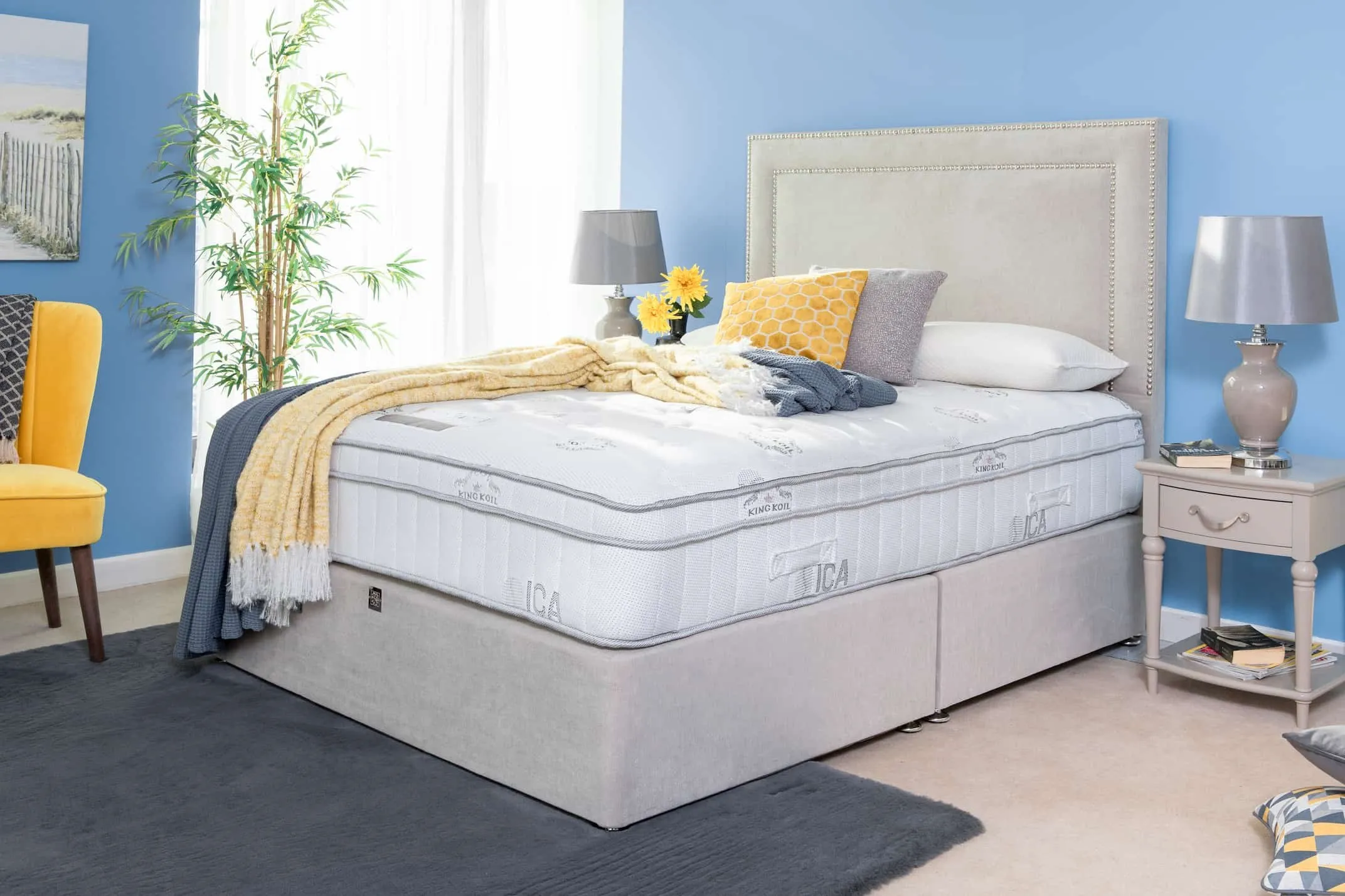 A lifestyle image of the small 6 feet super king size pocket visco Posture Serene mattress with a grey bedframe.