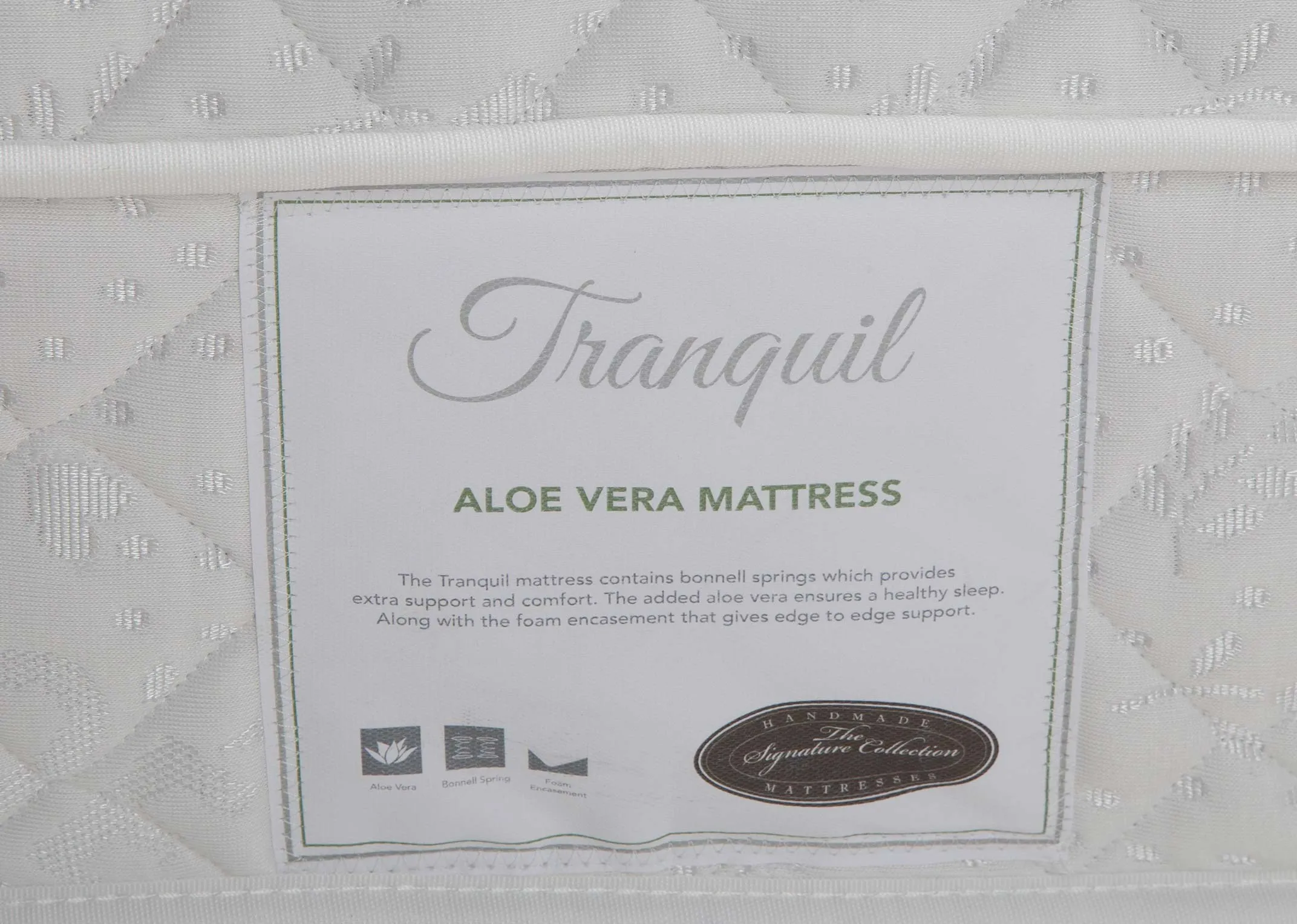 A close up of the tag on the Tranquil 3 ft mattress with various details listed.
