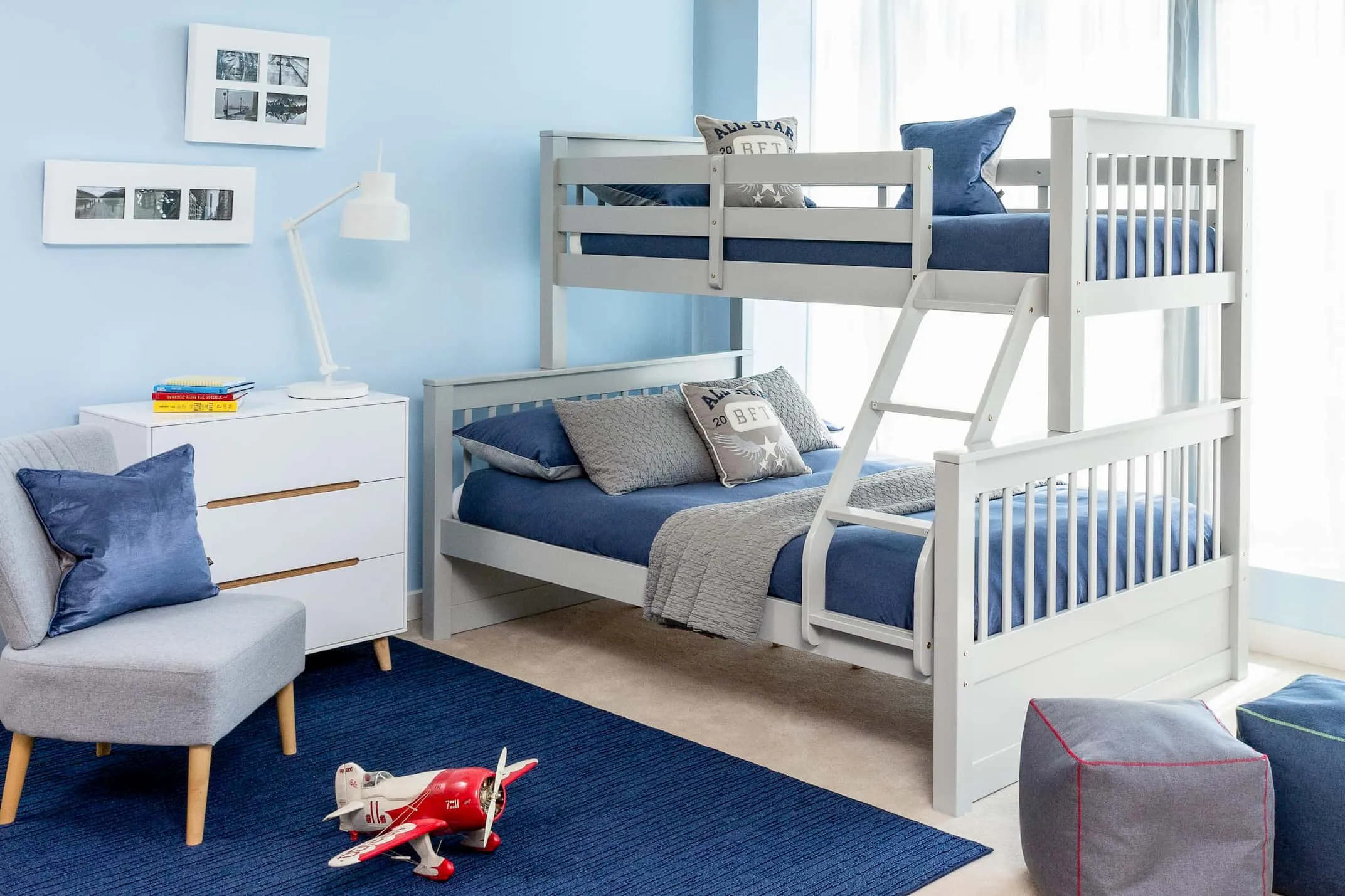 A lifestyle image of the Lara Twin Bunk Beds with the Bianca Chest & Abbie chair