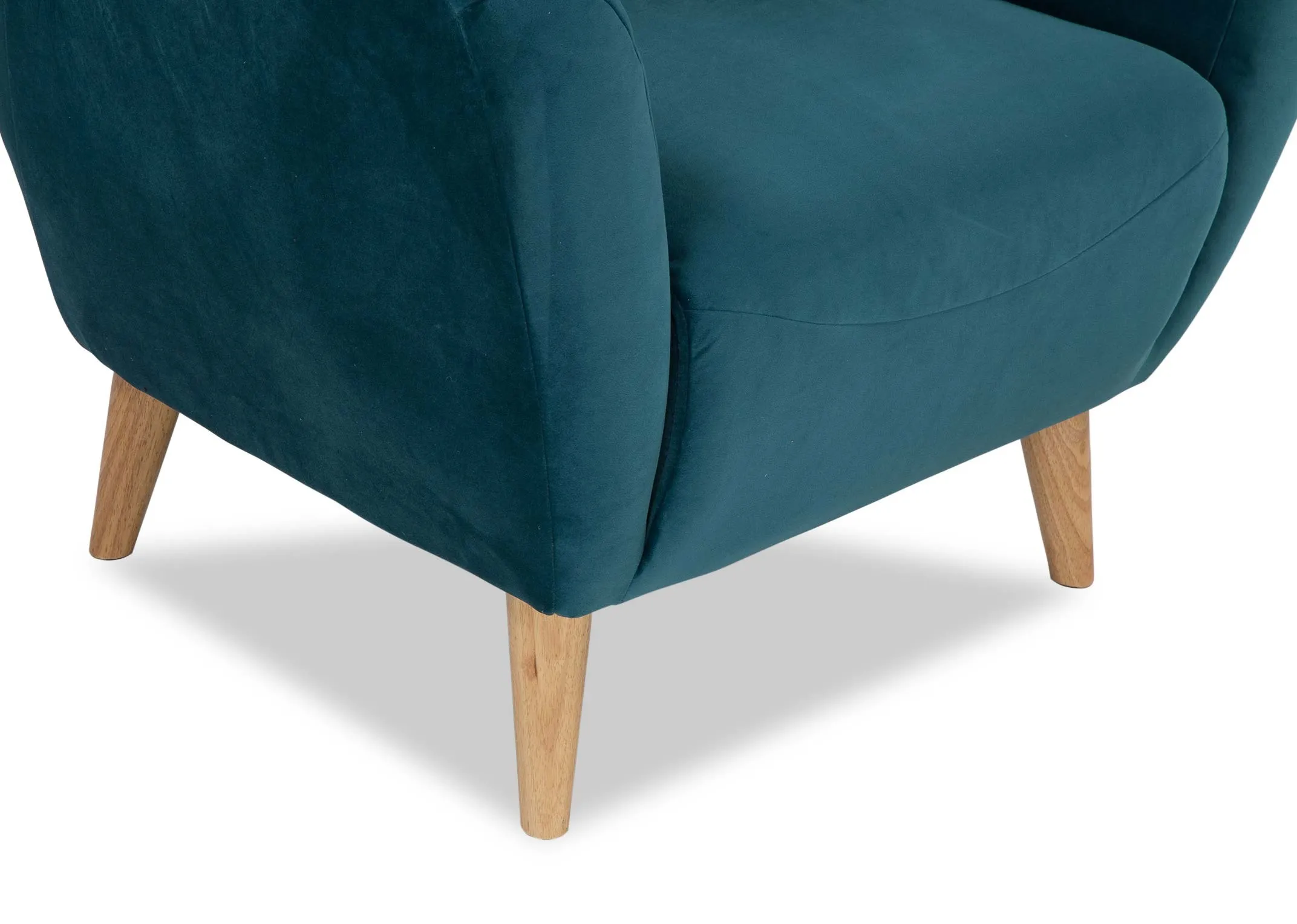 A close up of the legs on the Bronx armchair in teal velvet.
