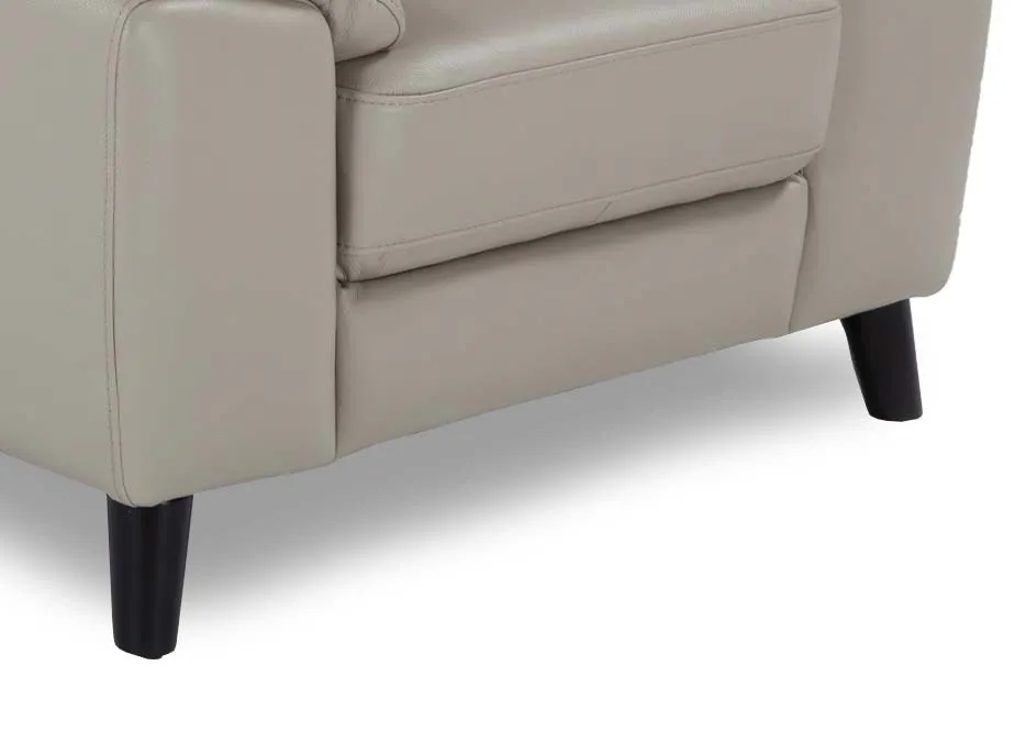 A close up of the peg shade blck foot on the light grey leather Alfredo armchair.