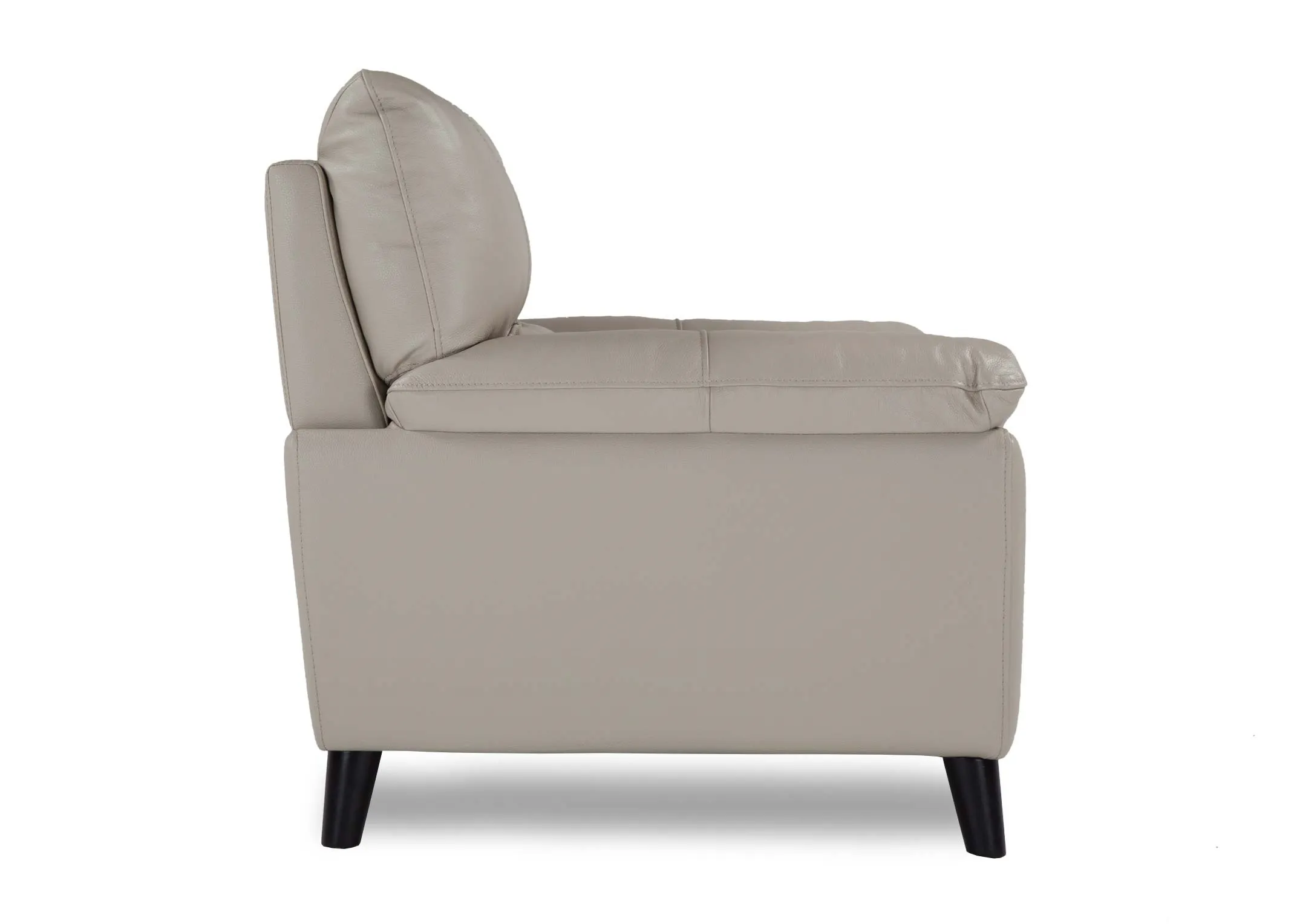 A view from the side of the light grey leather Alfredo armchair.