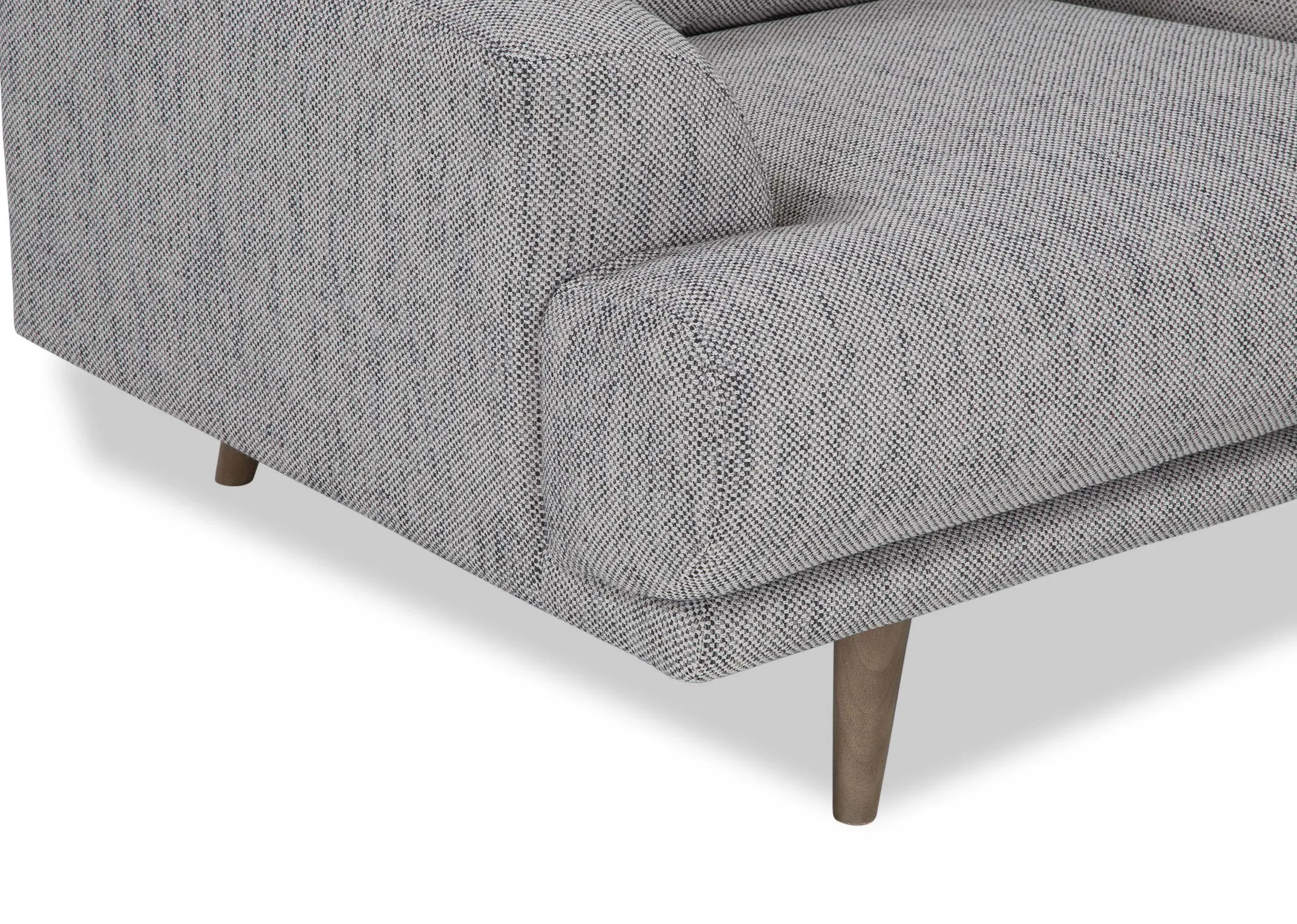 A close up of the legs on the Legend armchair in grey fabric.