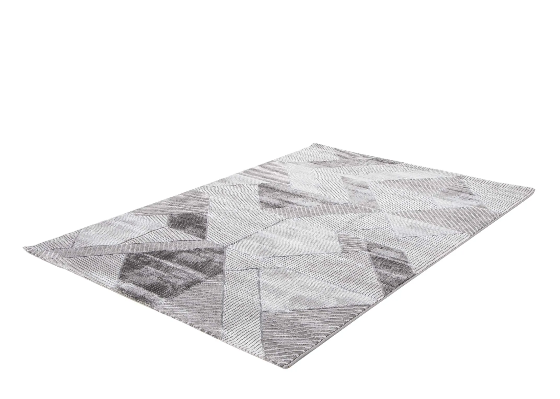An angled view looking at the small geometric grey Dexter rug