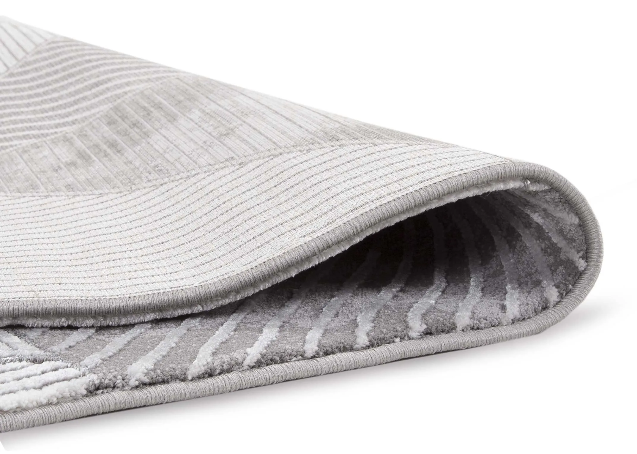 A close up view of the small geometric grey Dexter rug