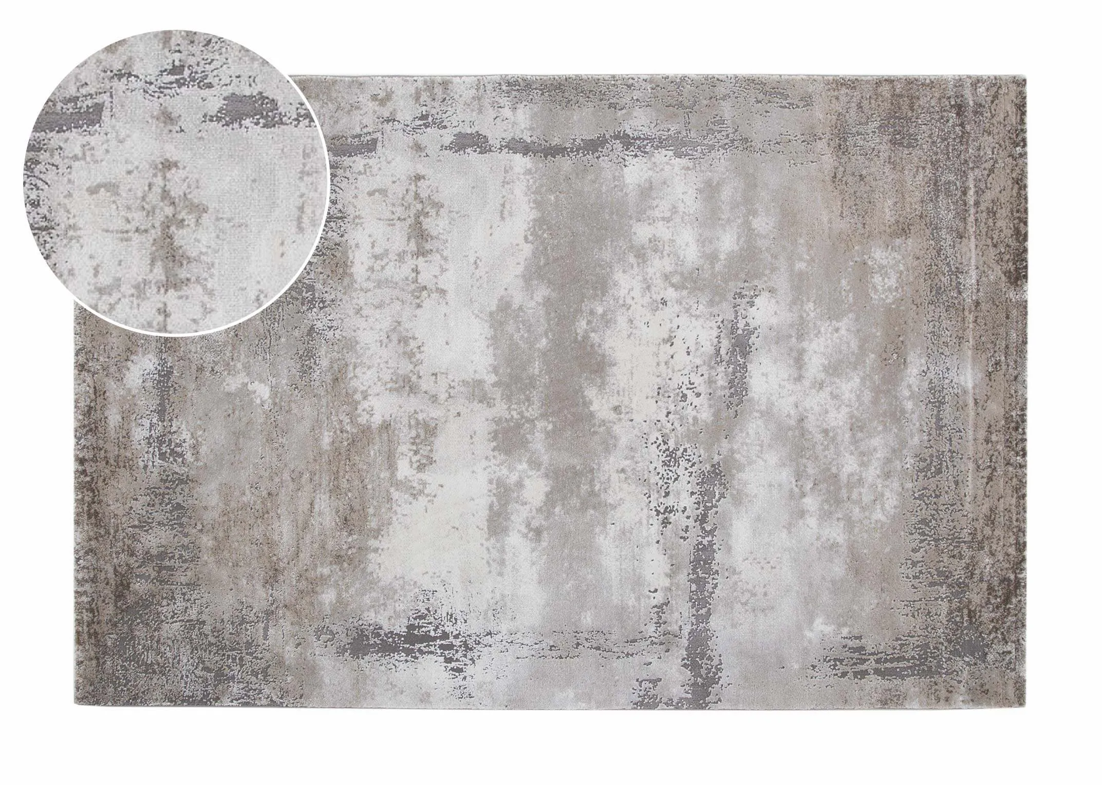 A distressed grey rug with ombre shapes from EZ Livings Kylo range. Closeup window on fabric and texture
