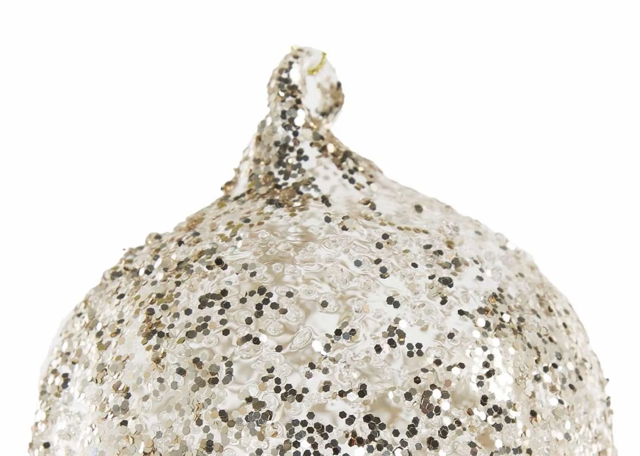 A gold glass bauble covered in glitter from EZ Living Furniture's Christmas range. Closeup of glitter detail