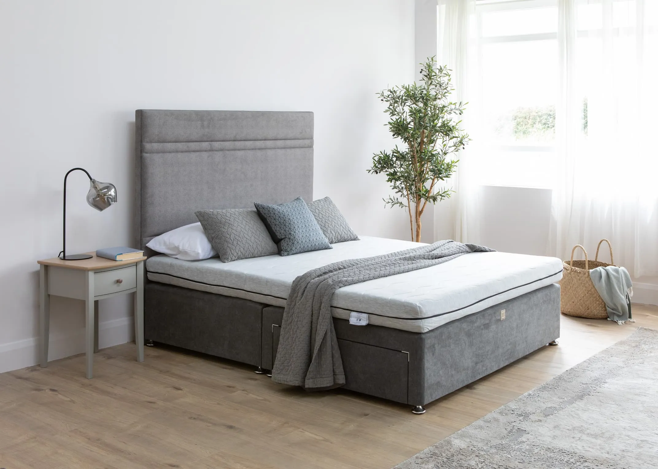 A lifestyle image of the Comfort Foam Mattress on a King Koil Divan bed with Whitby locker & rakel lamp.