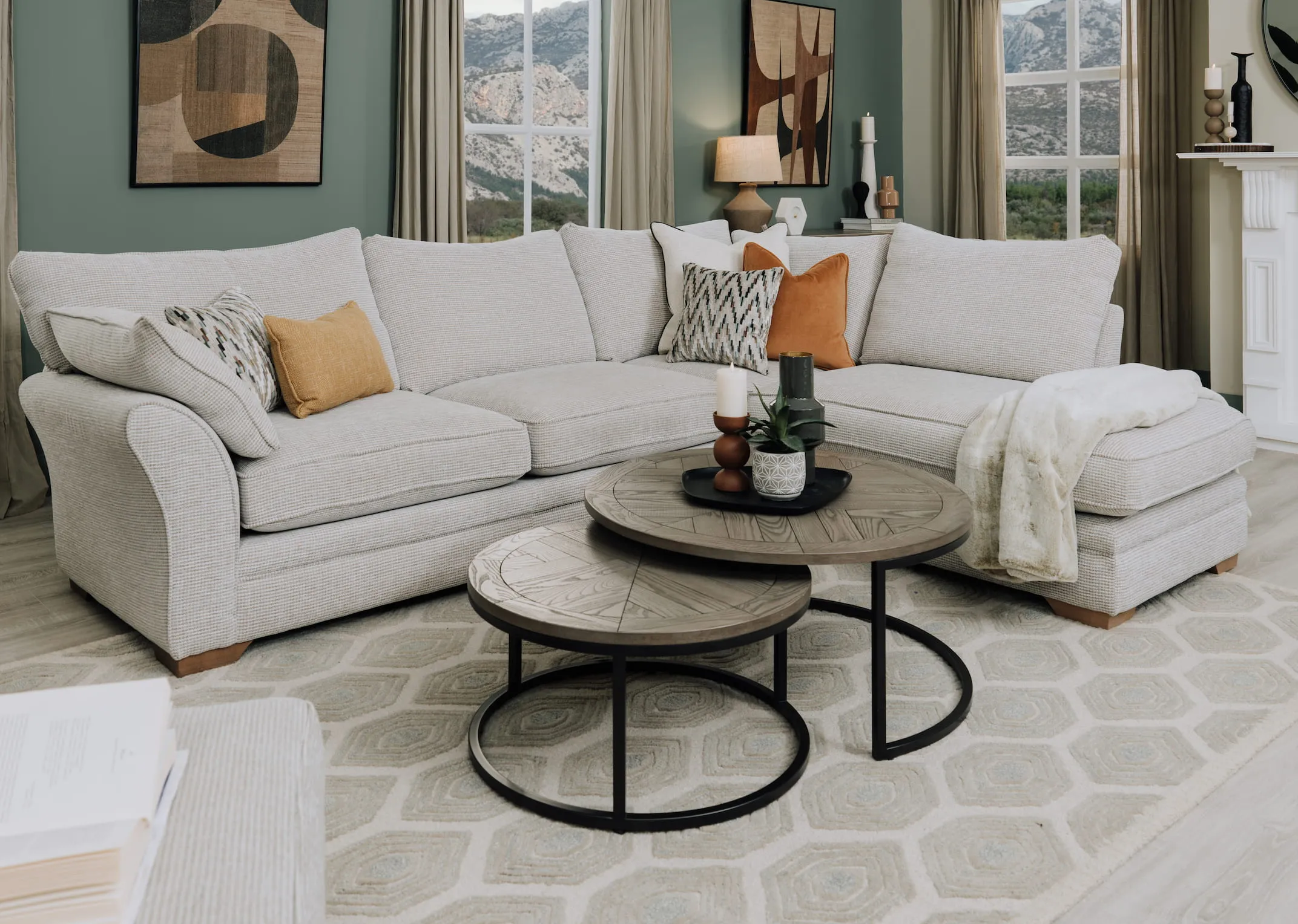 A lifestyle image of the Strata LAF chaise with Monroe tables and zene rung.