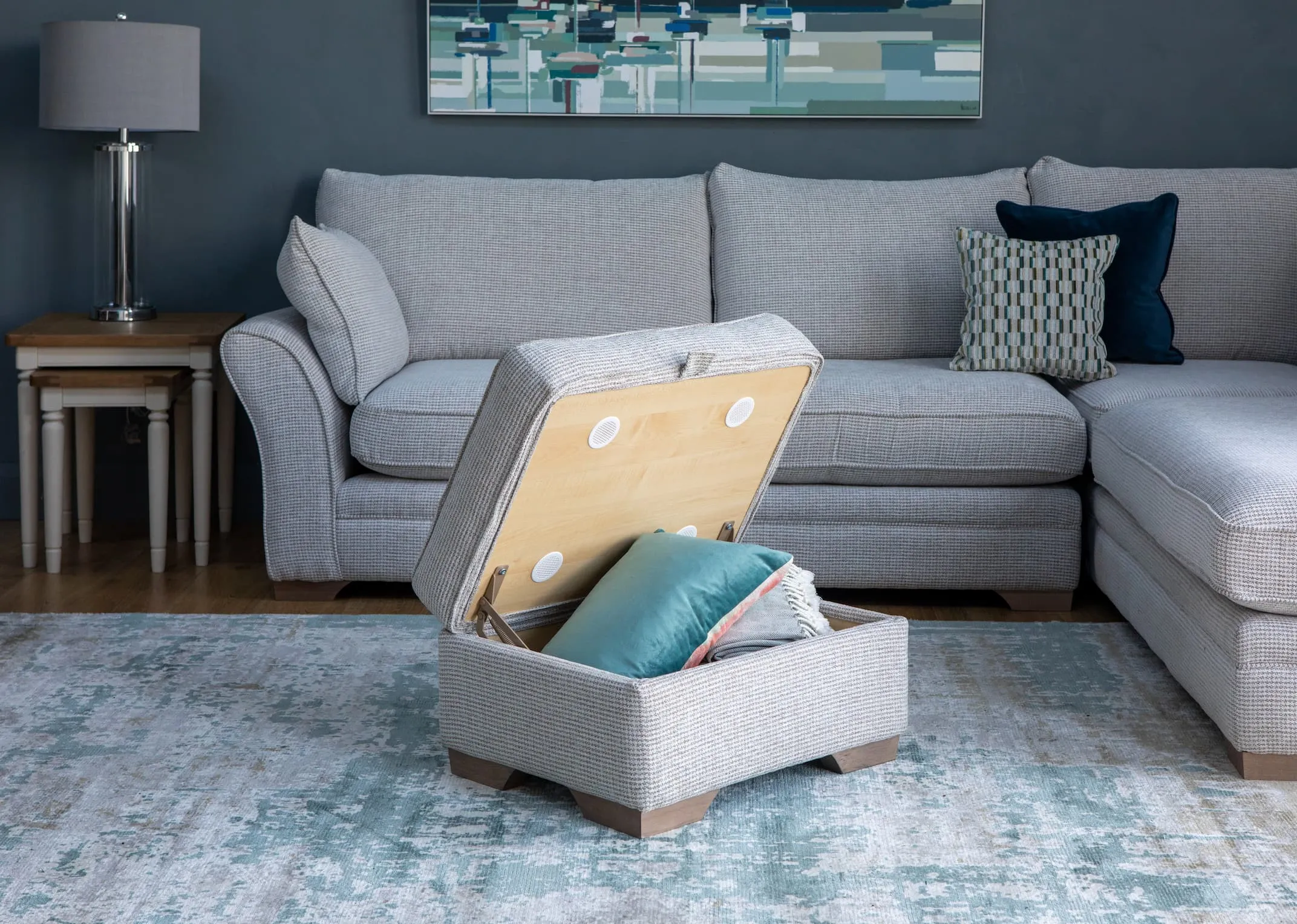 A lifestyle image of the Strata LAF Corner sofa with farmhouse furniture & strata storage footstool