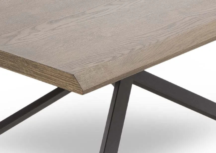 A smoked oak coffee table with black metal legs from EZ Living Furnitures Arno range. Closeup view of edge.