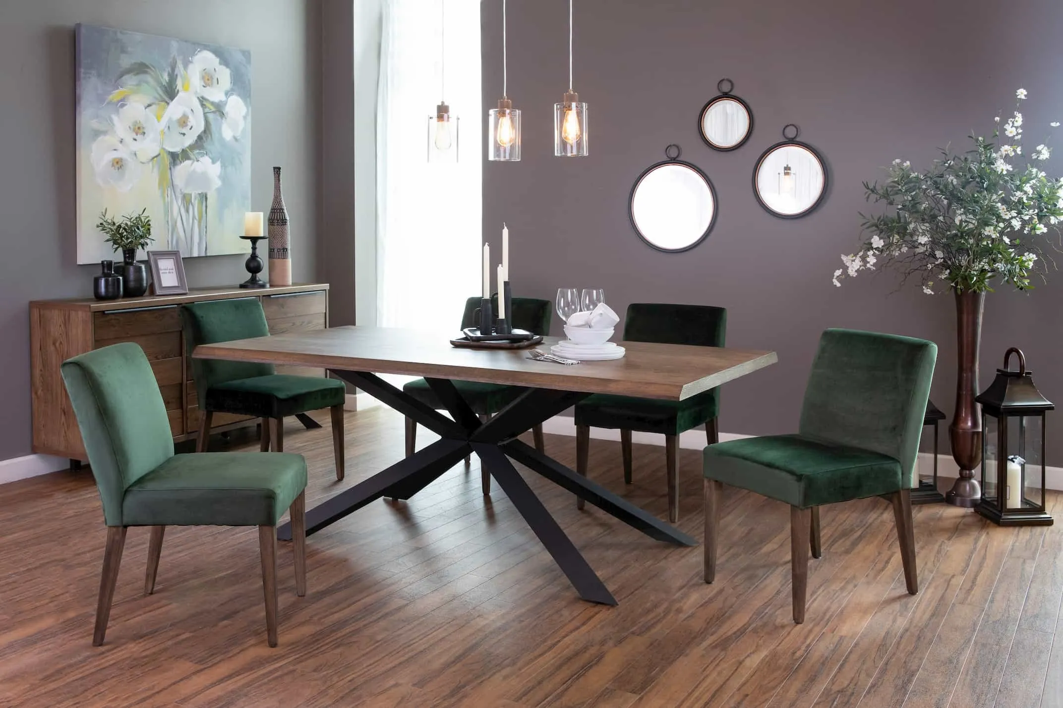 A lifestyle image of the Norton Ceiling light in gold with the Arno Dining Range & Ideal Mirrors